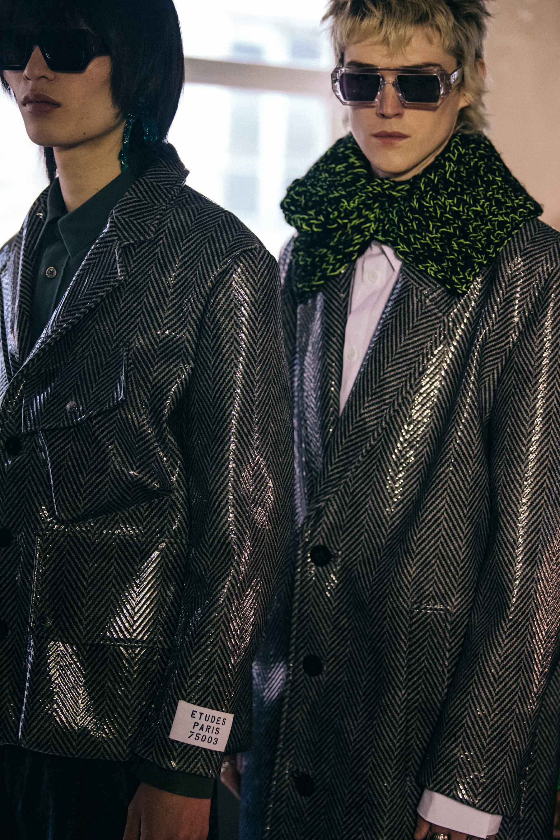 Models wearing grey outfits
