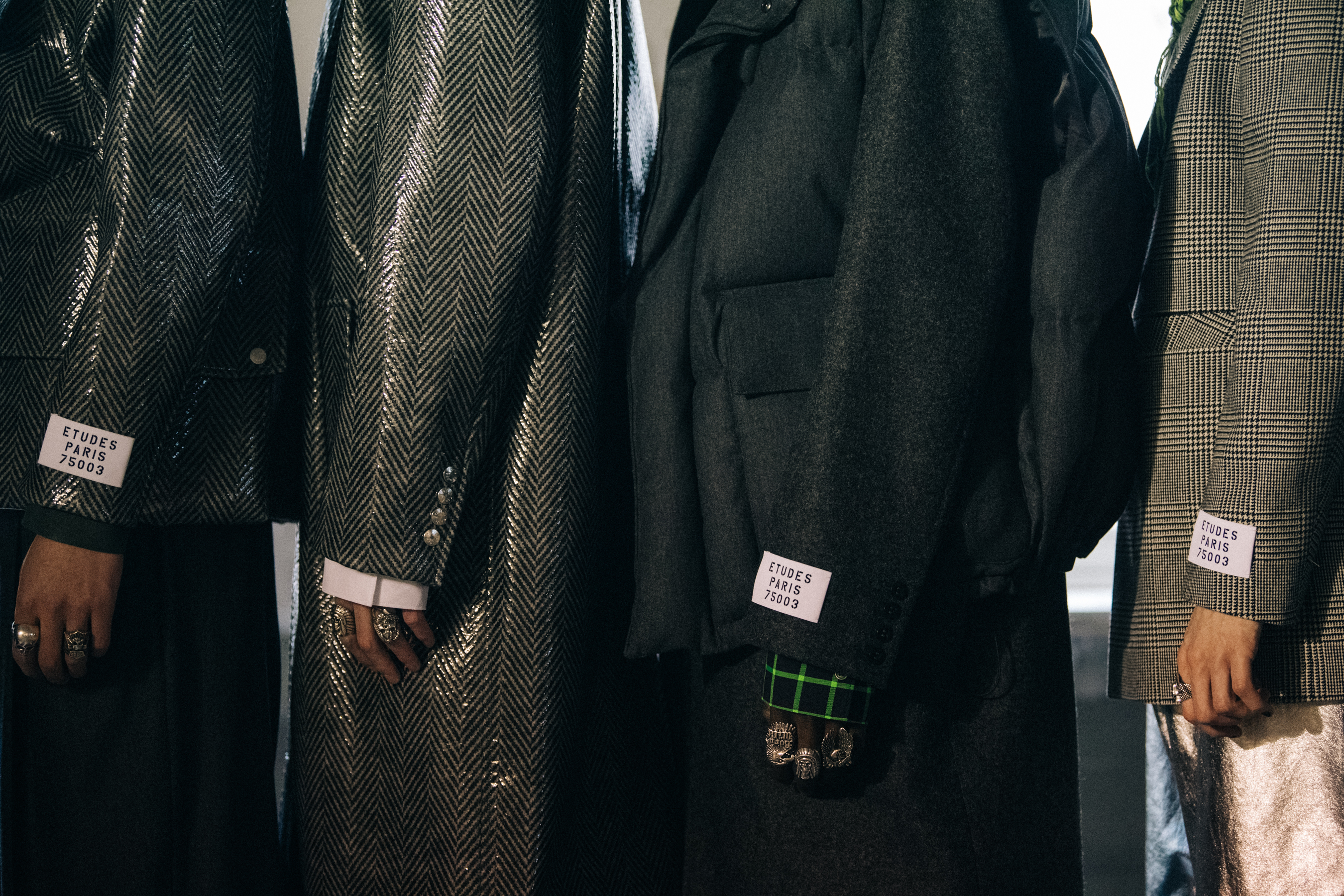 Models wearing grey outfits