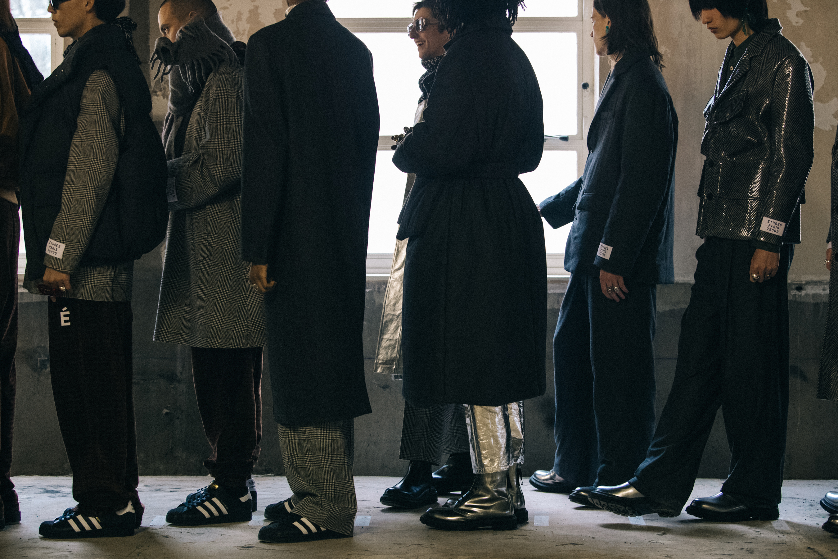 Models wearing grey outfits