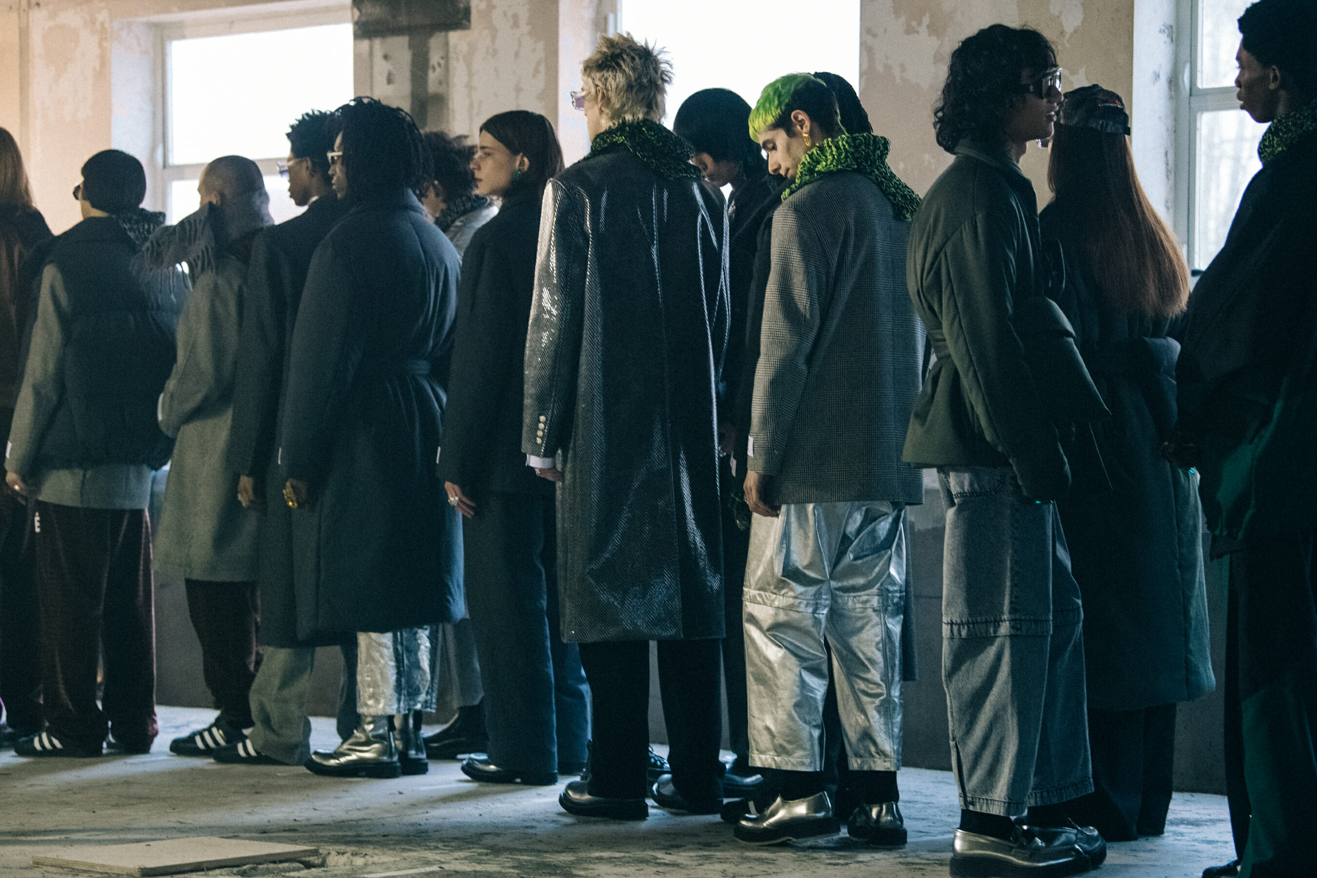 Models wearing grey outfits