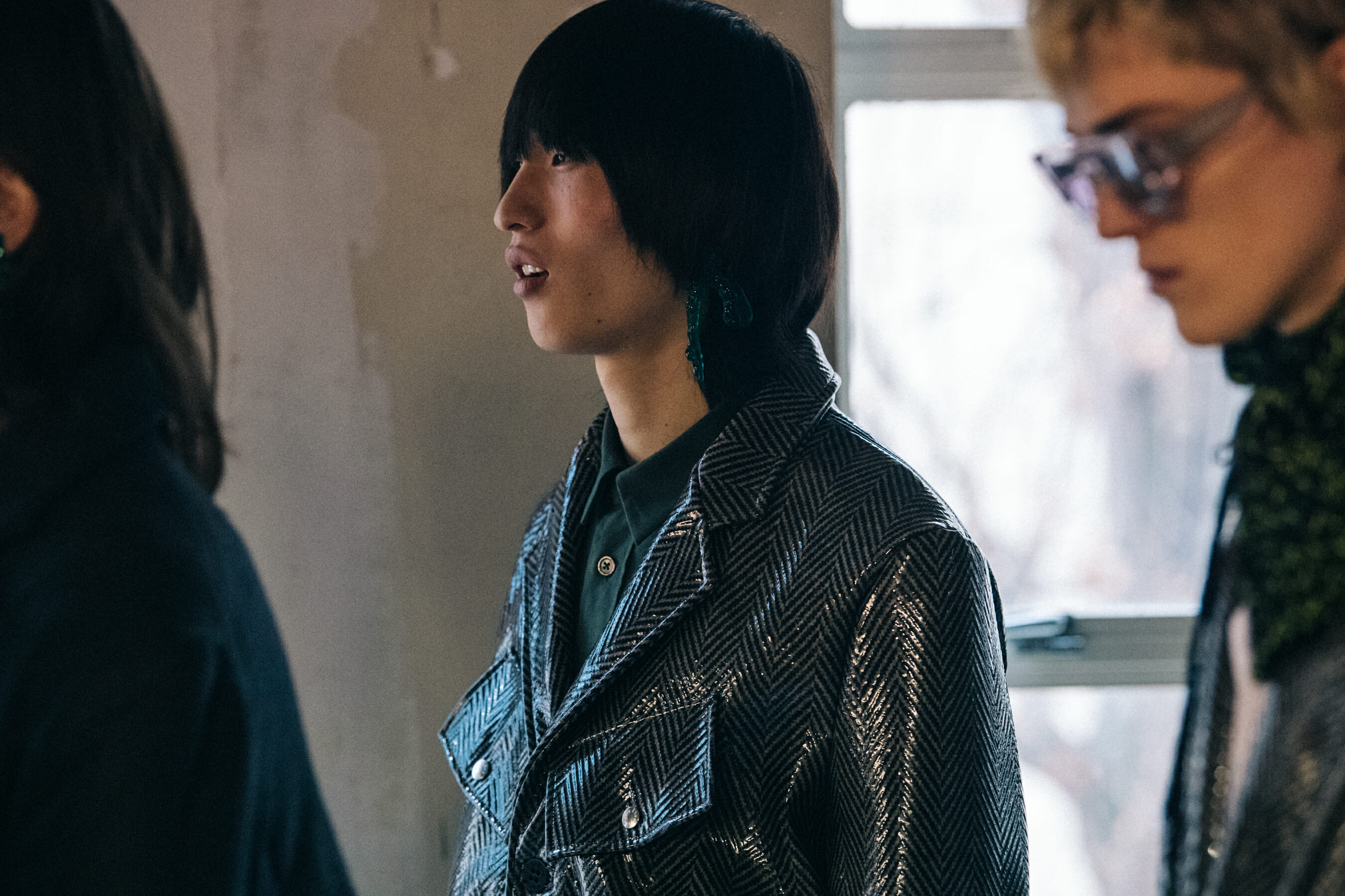 Models wearing grey outfits