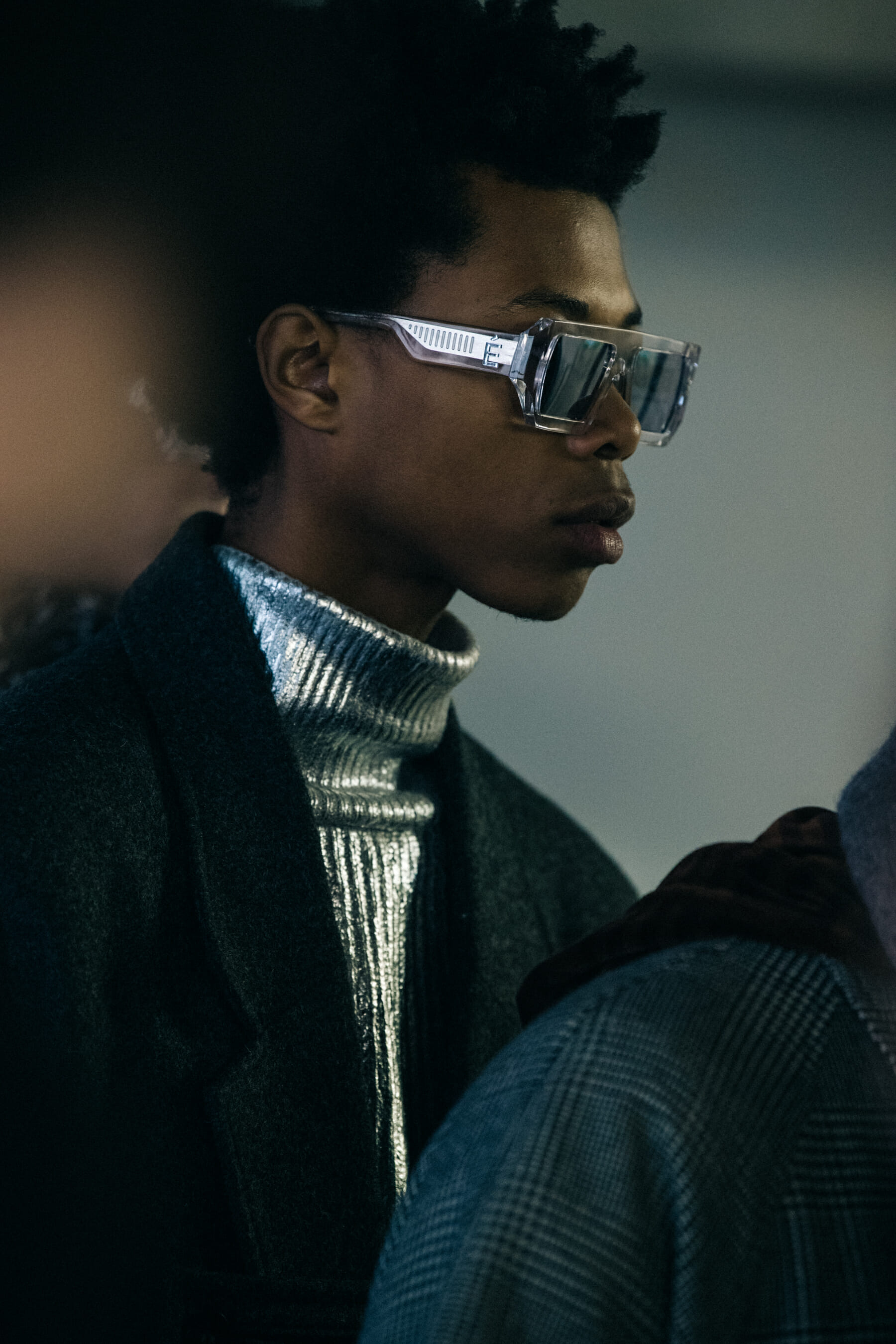 Models wearing grey outfits