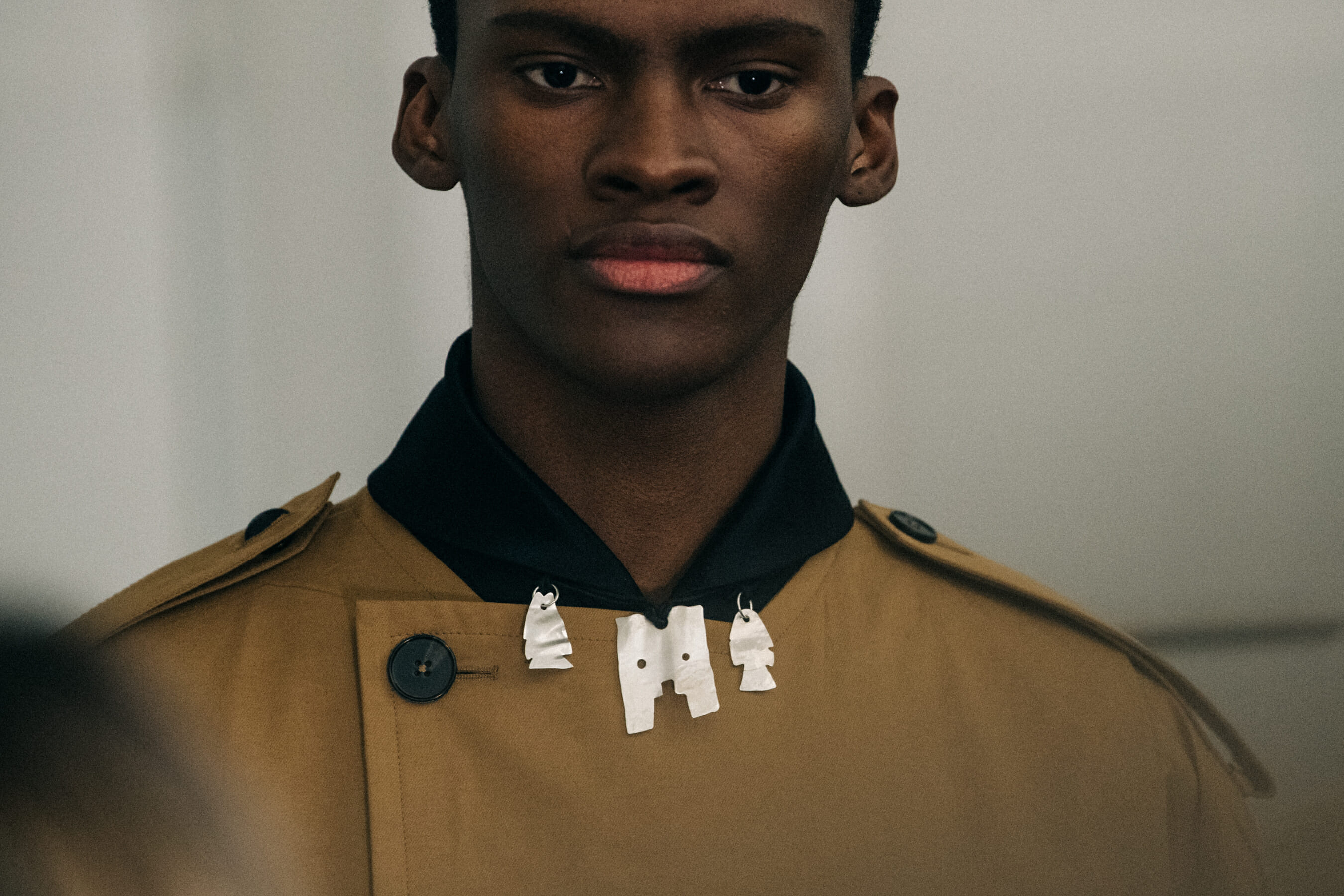 Model wearing tan Jil Sander outfits