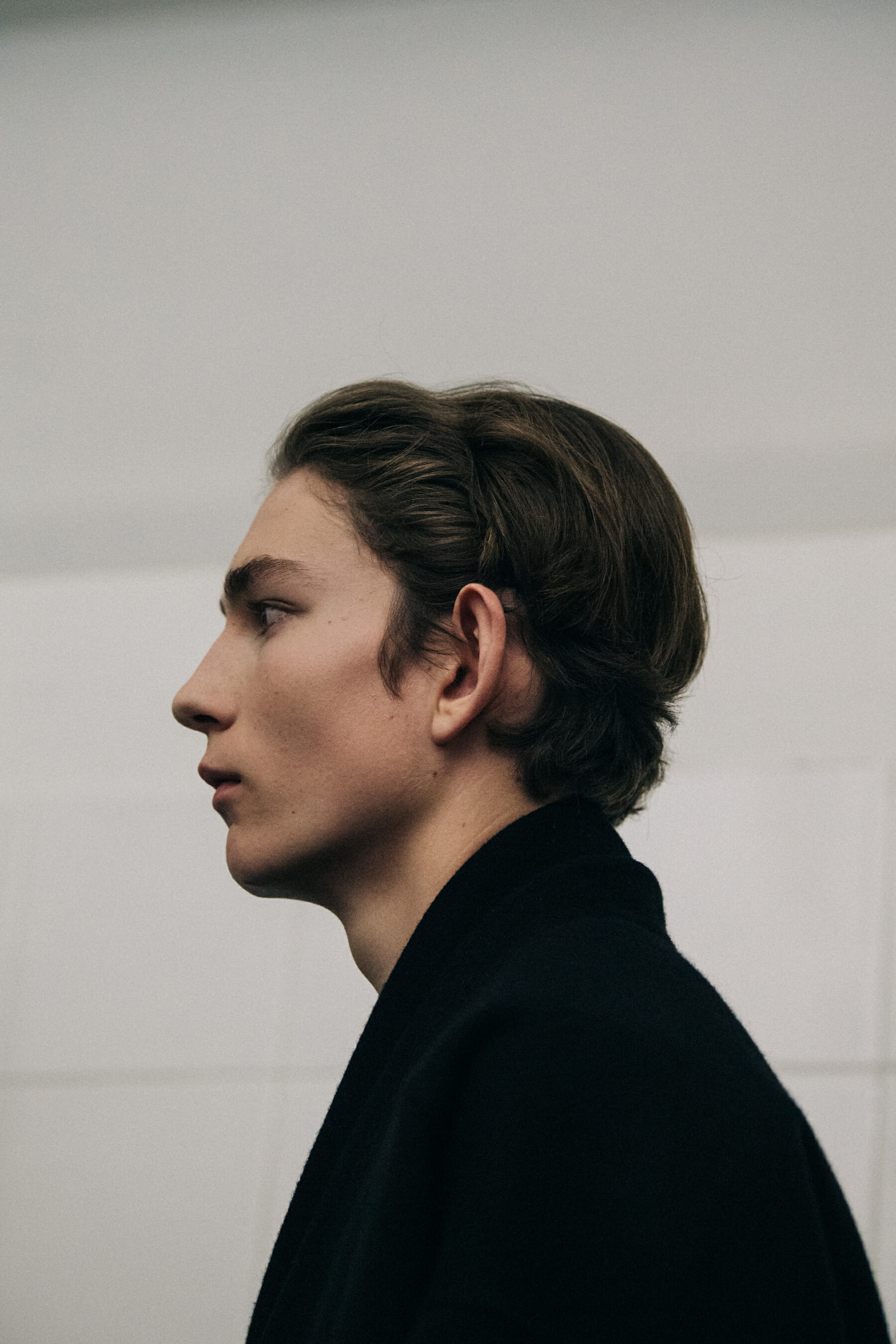 Models wearing dark Jil Sander outfits