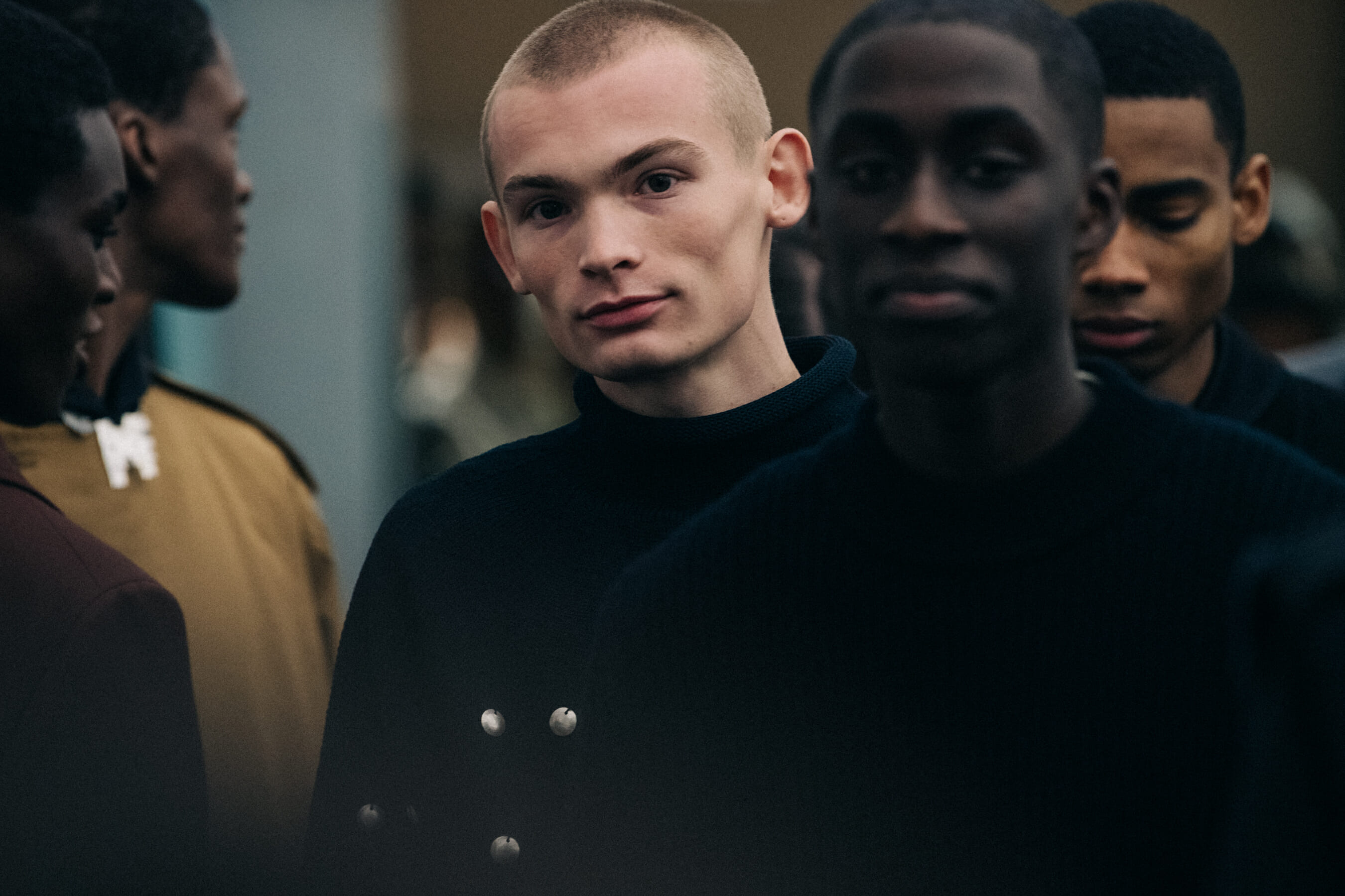 Models wearing dark Jil Sander outfits