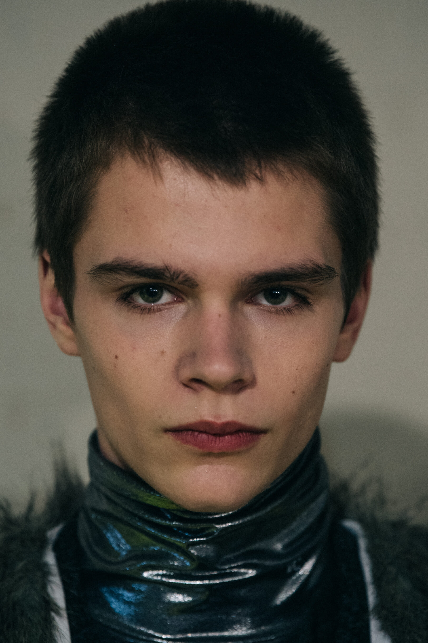 Models wearing fur at Raf Simons