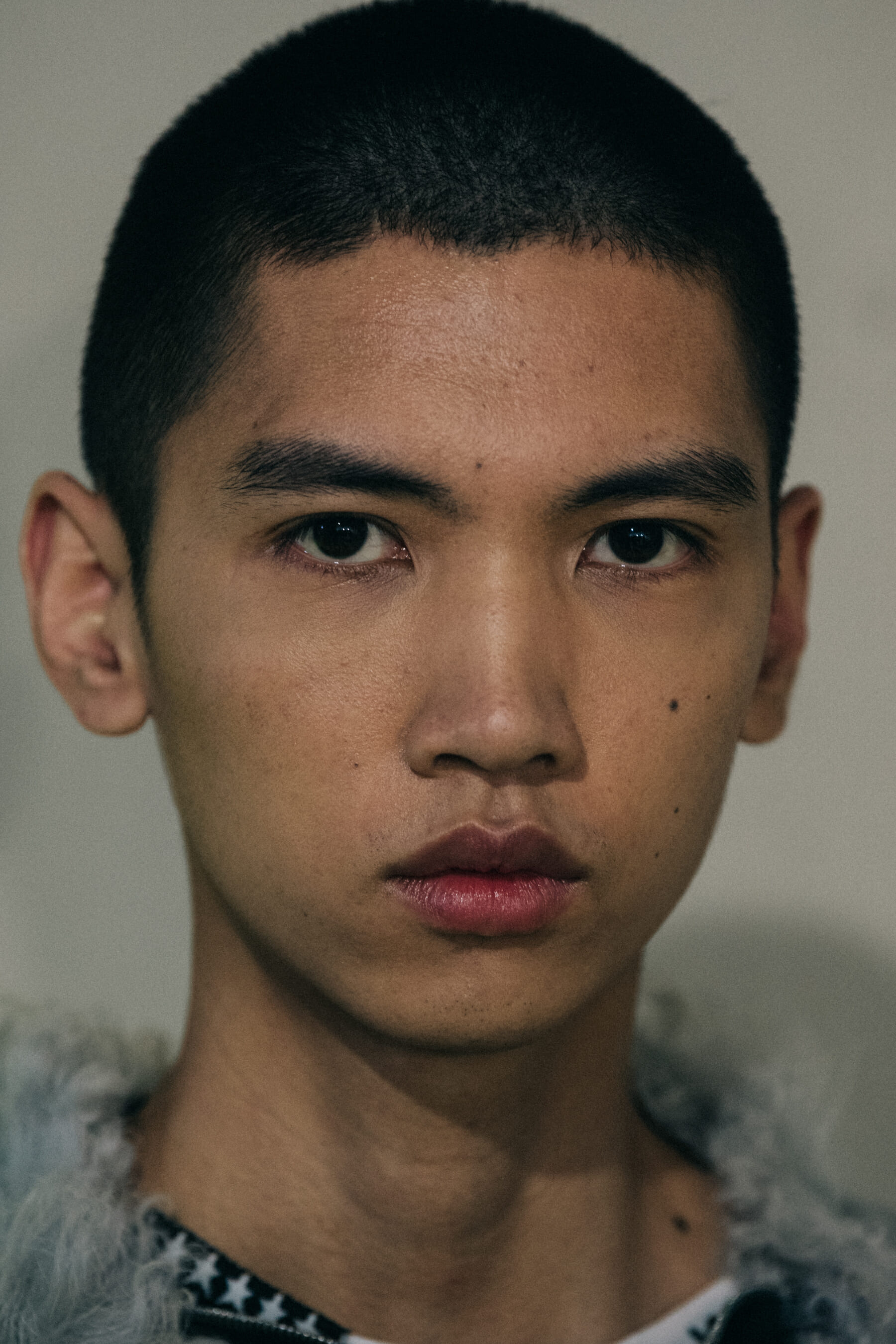 Models wearing fur at Raf Simons