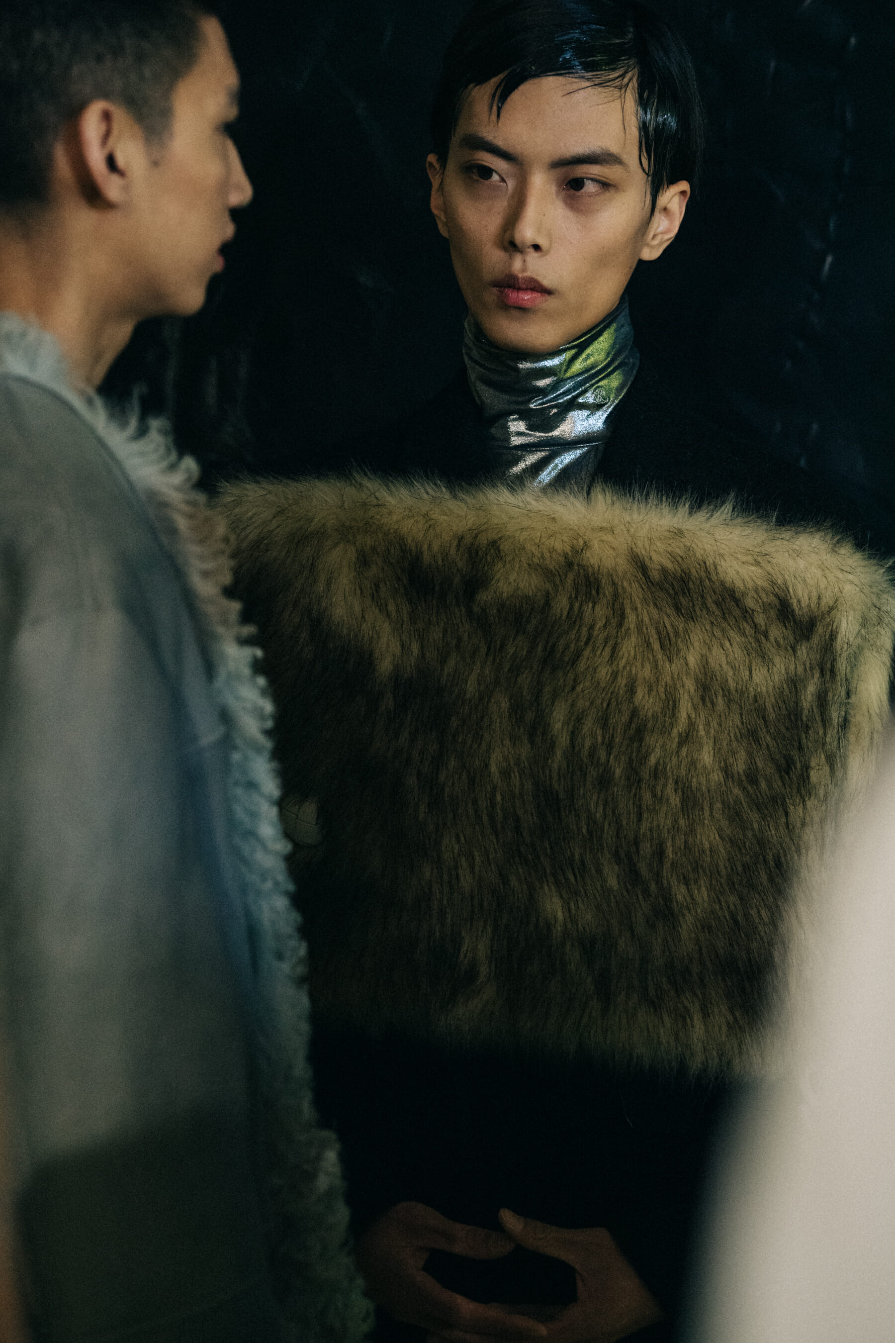 Models wearing fur at Raf Simons