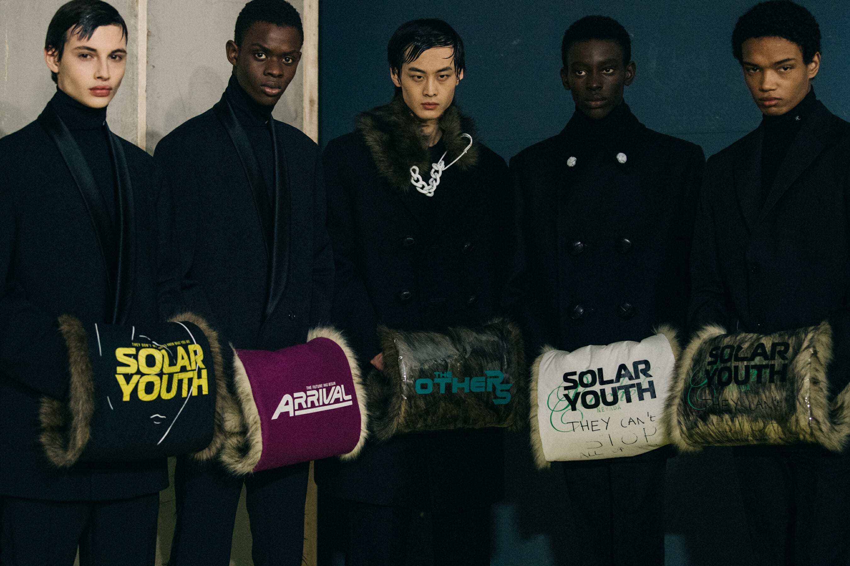 Models wearing black Raf Simons