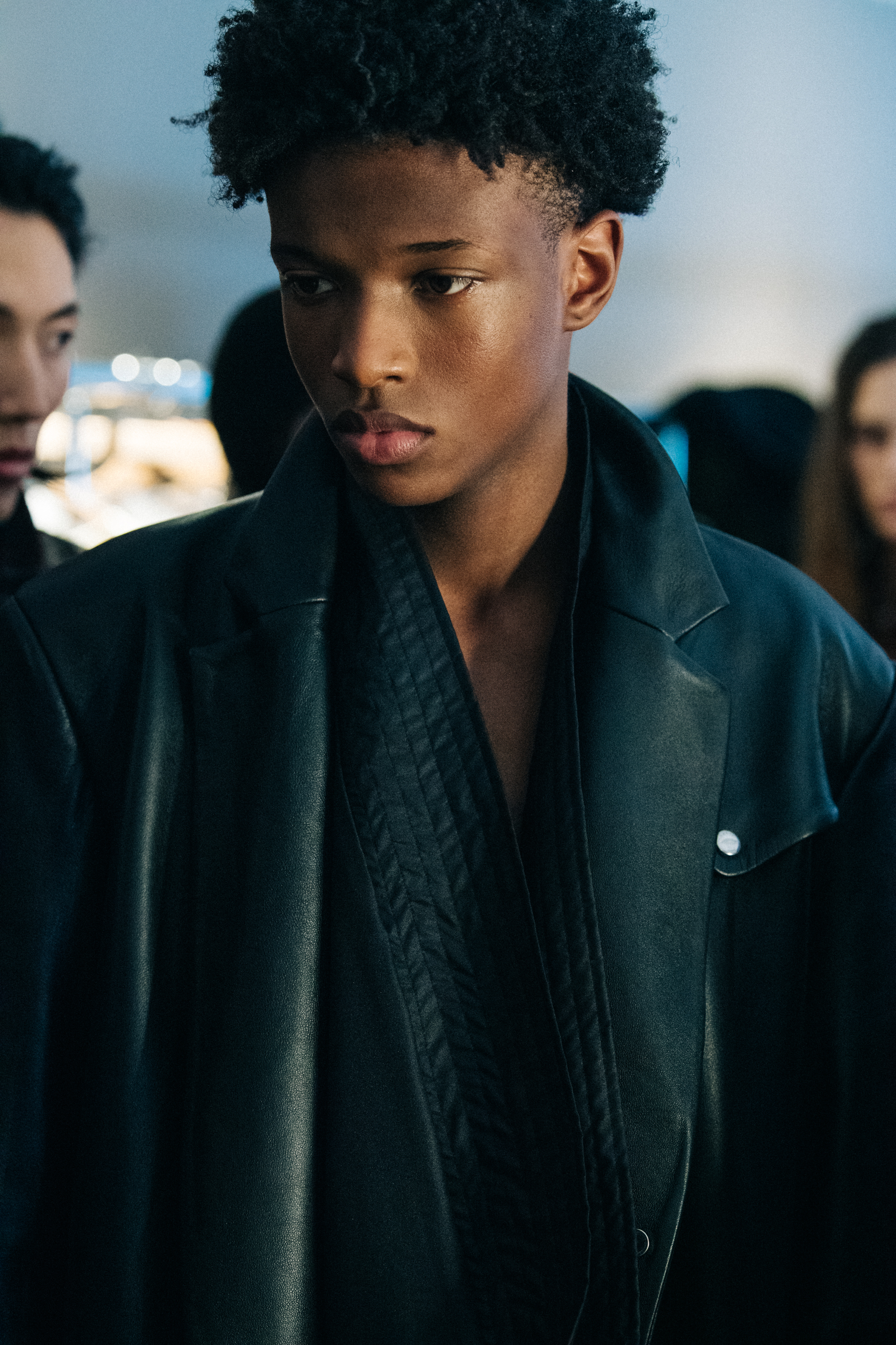 Model wearing dark jacket
