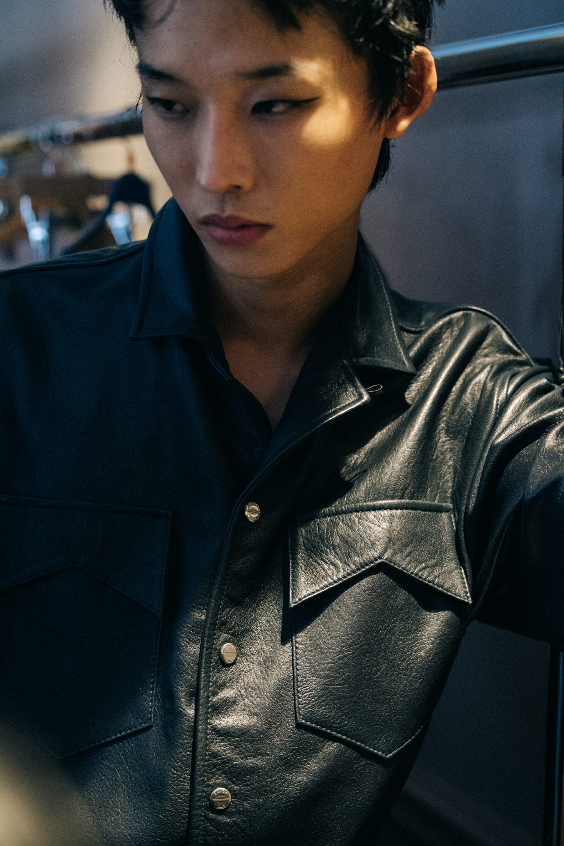 Model wearing leather shirt