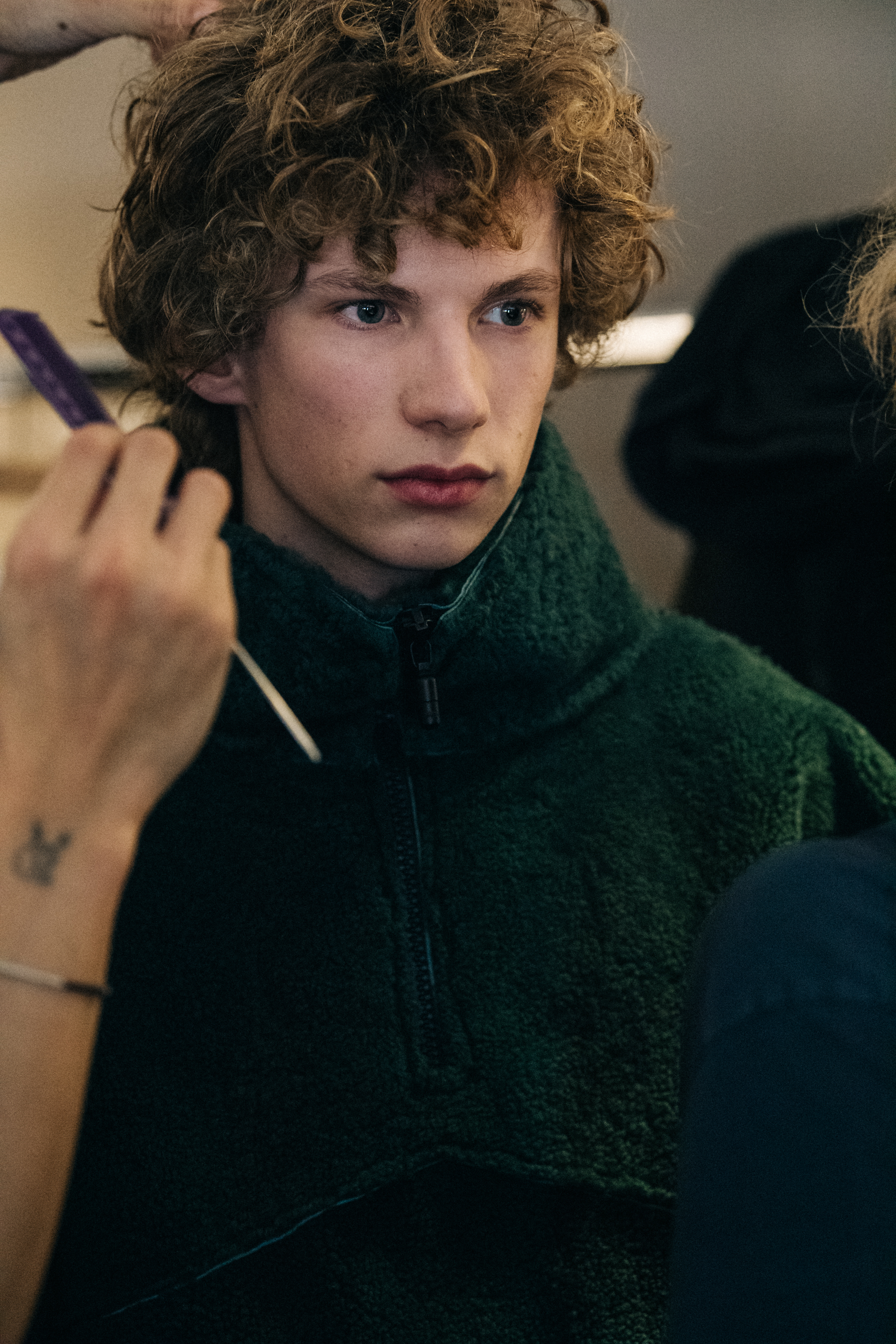 Model wearing dark jacket