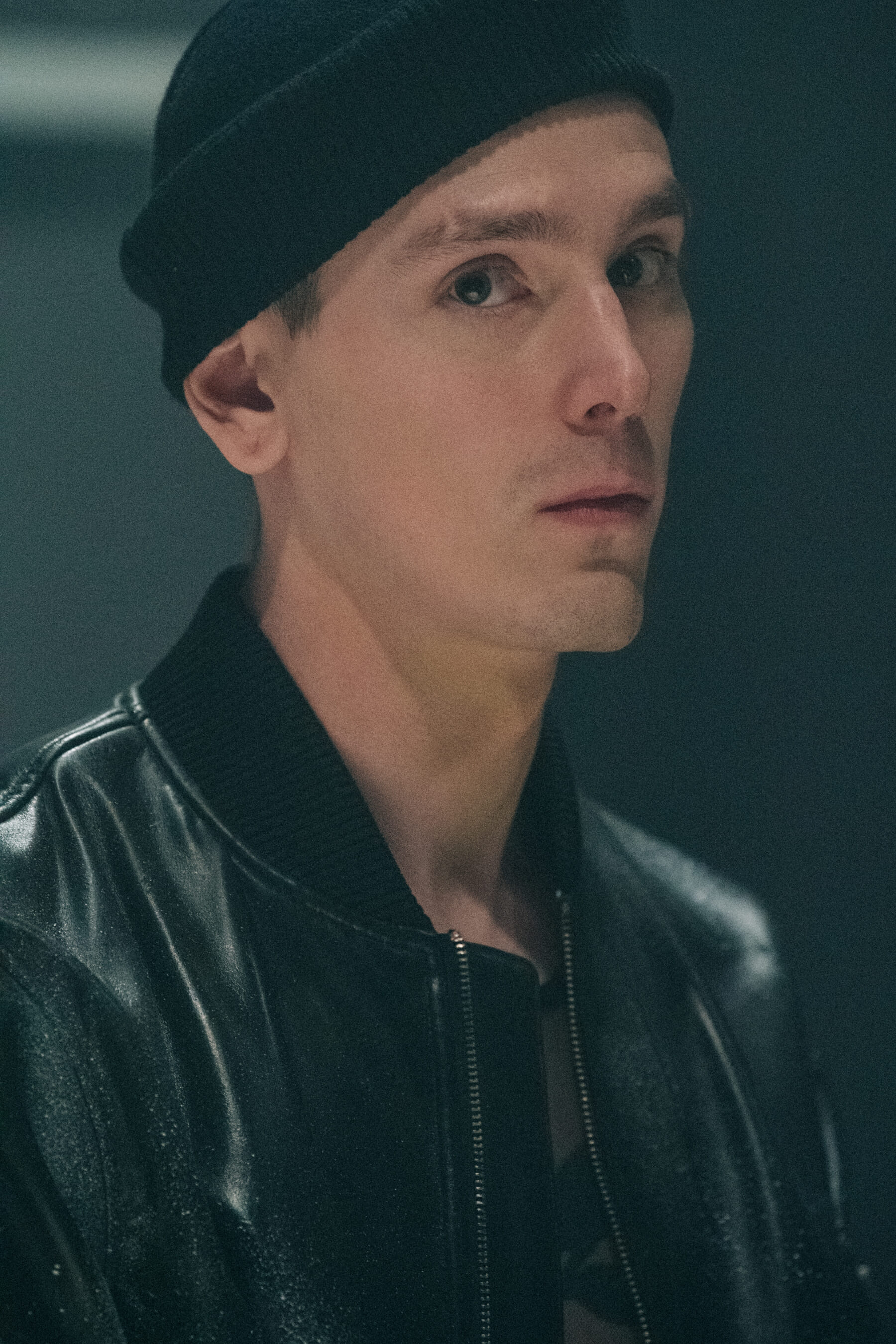 Model wearing black beanie backstage