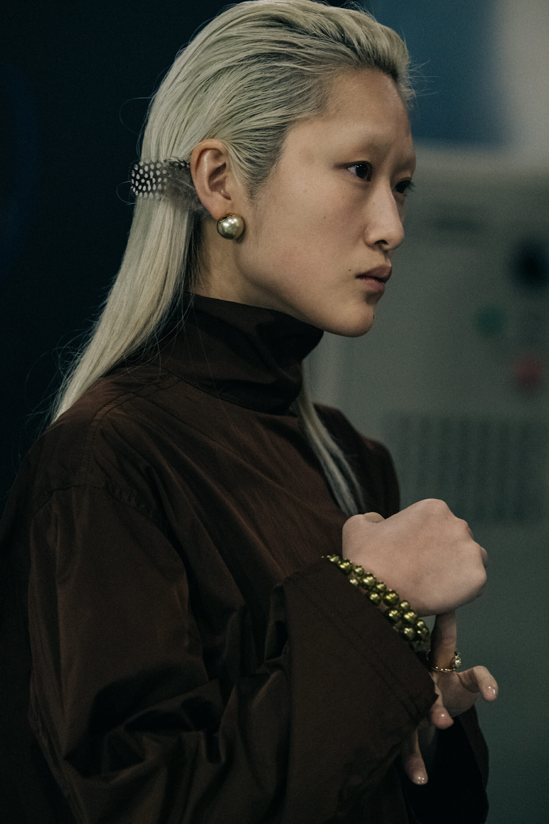 Model wearing silver and gold jewellery
