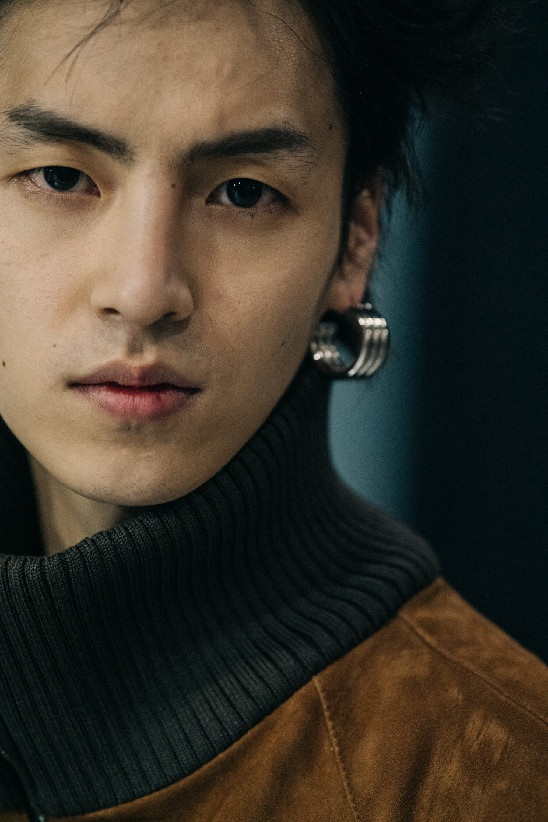 Model wearing silver and gold jewellery