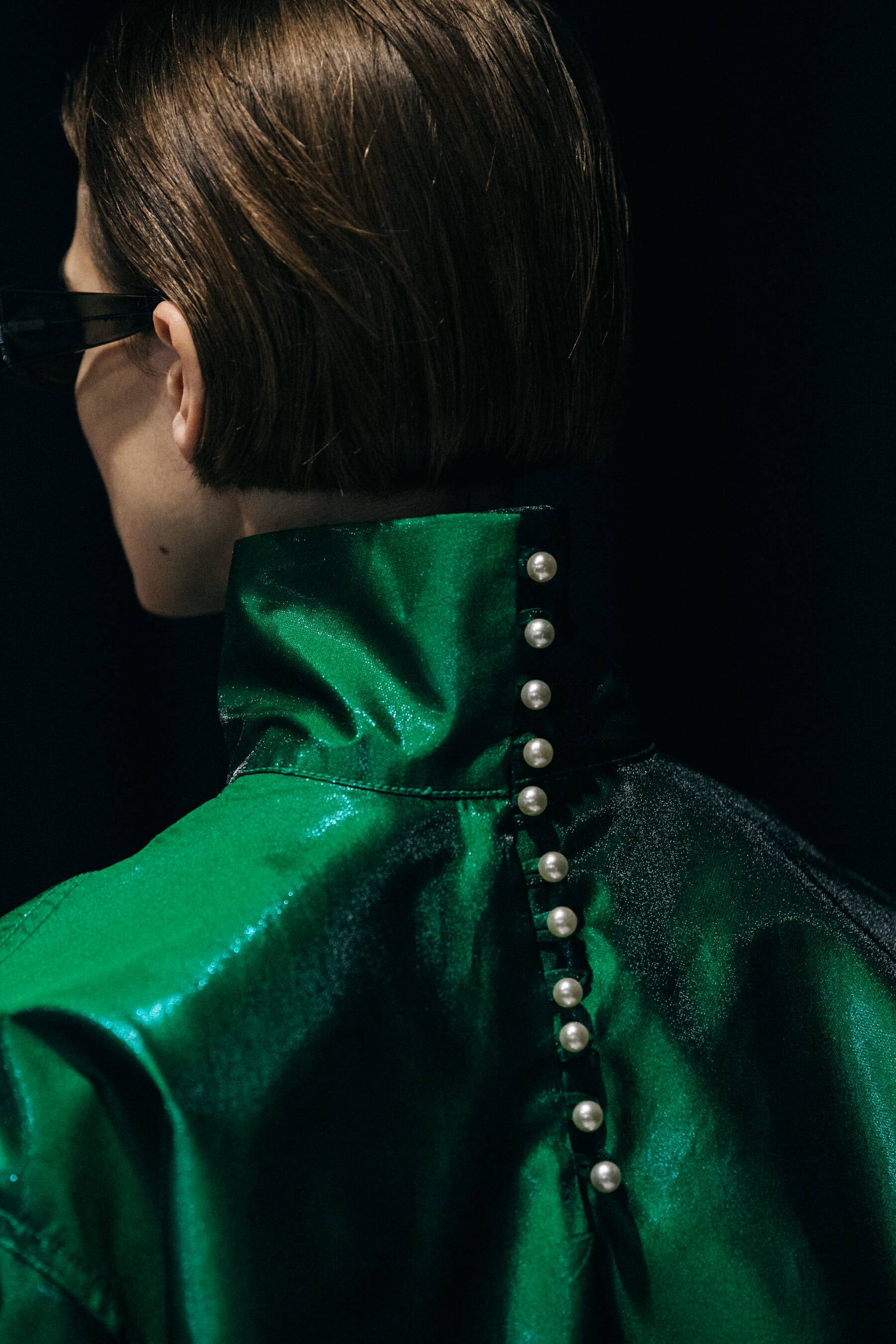 Model wearing green outfit at Sunnei