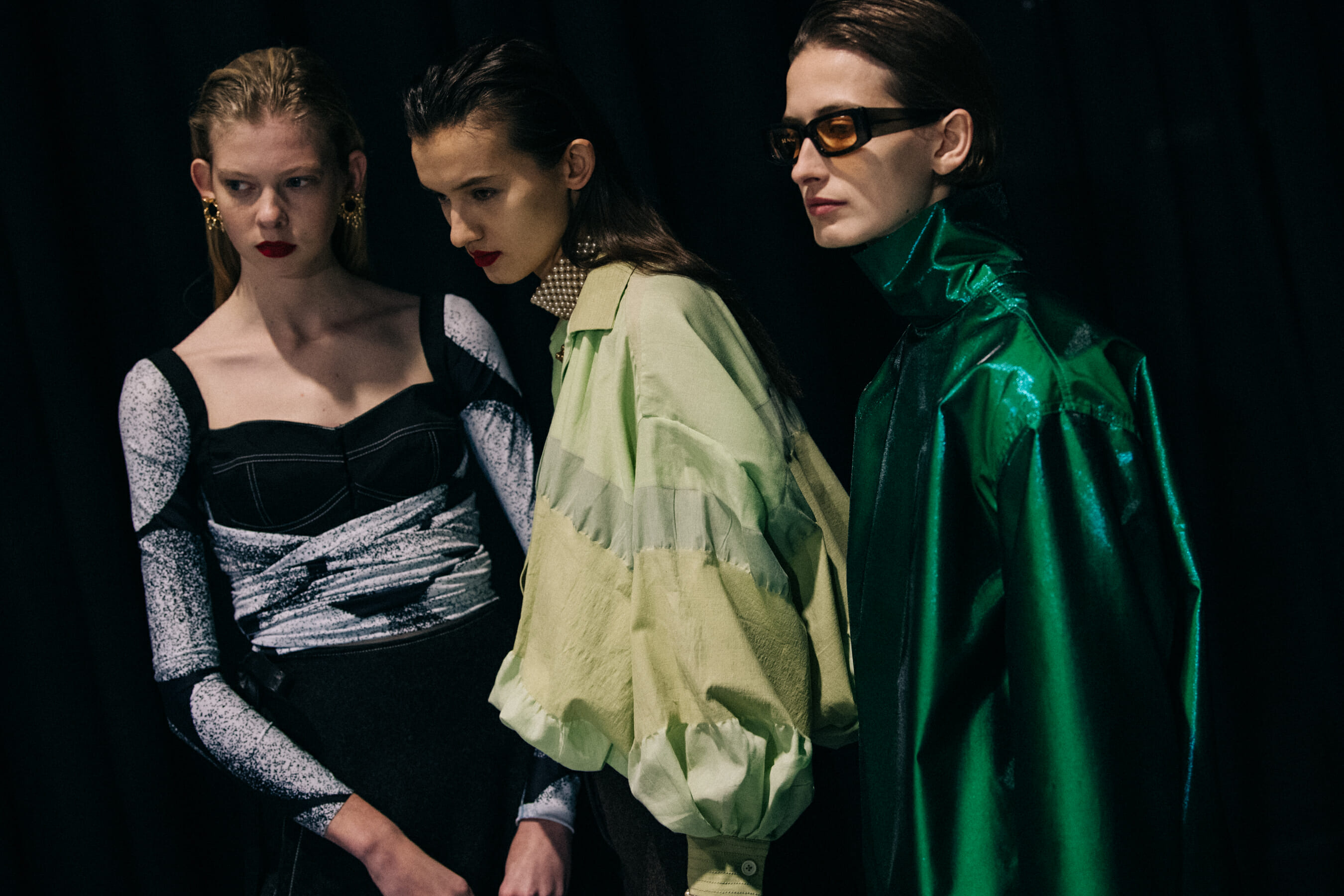 Models wearing Sunnei outfits backstage