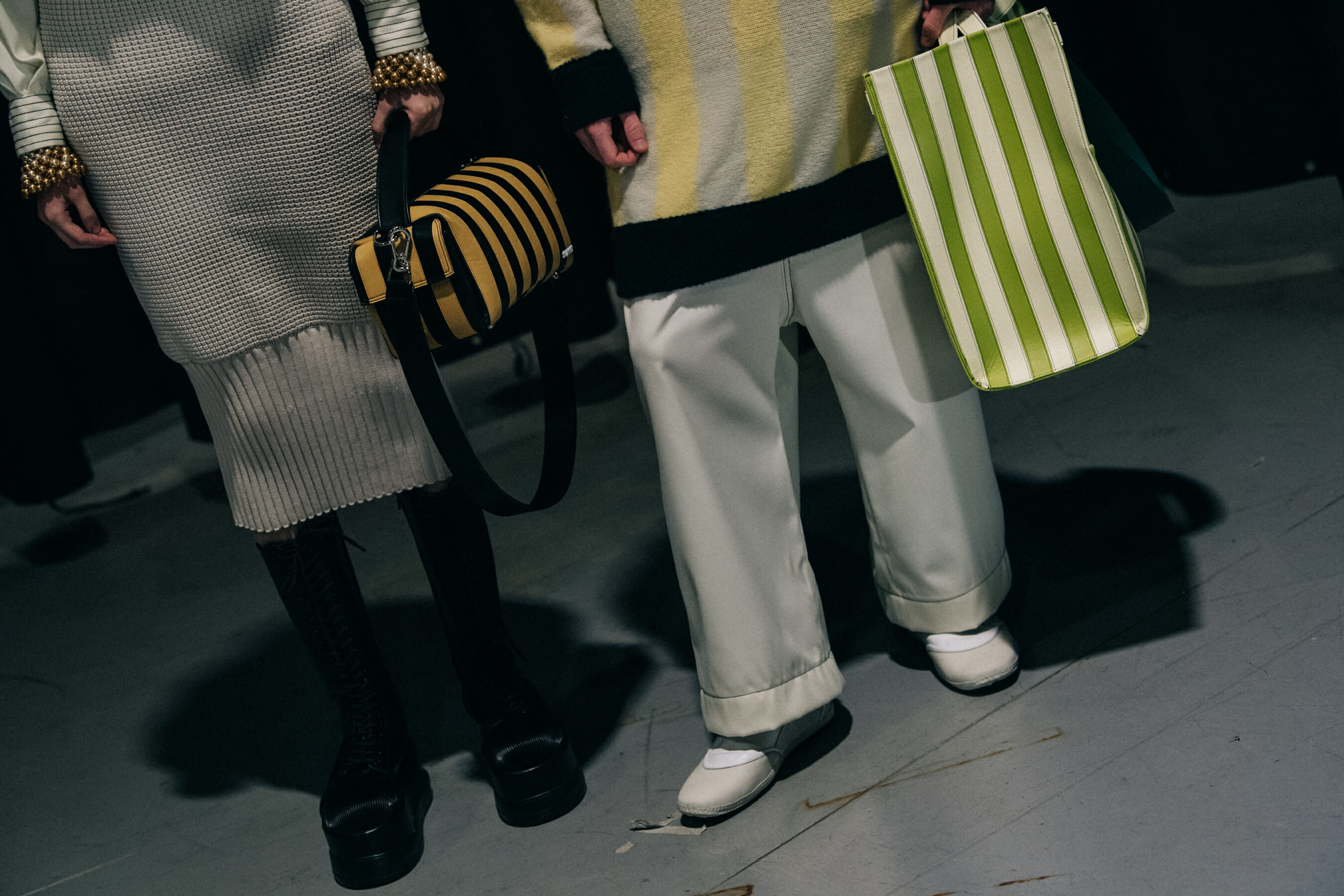 Models carrying Sunnei bags
