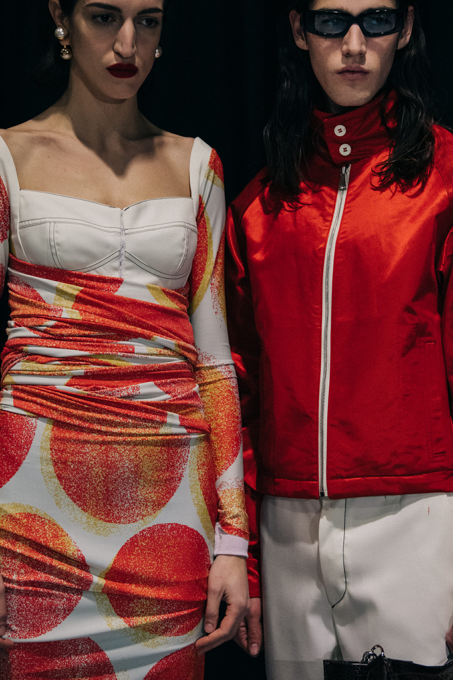 Models wearing red outfits at Sunnei
