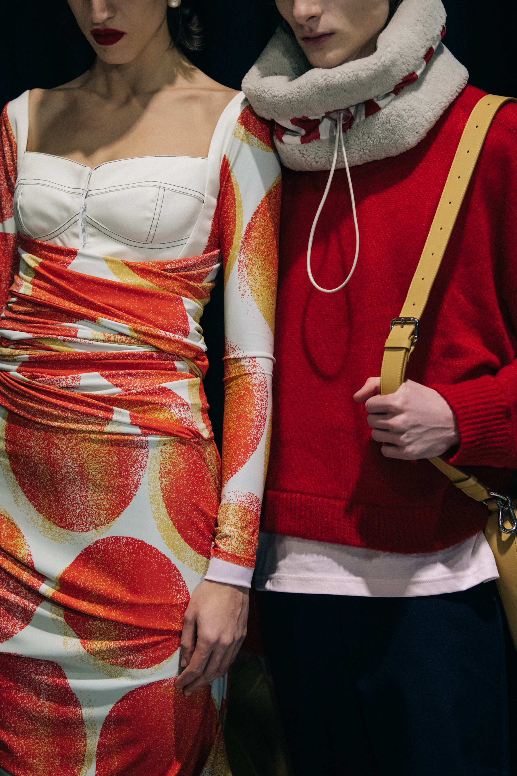Models wearing red outfits at Sunnei