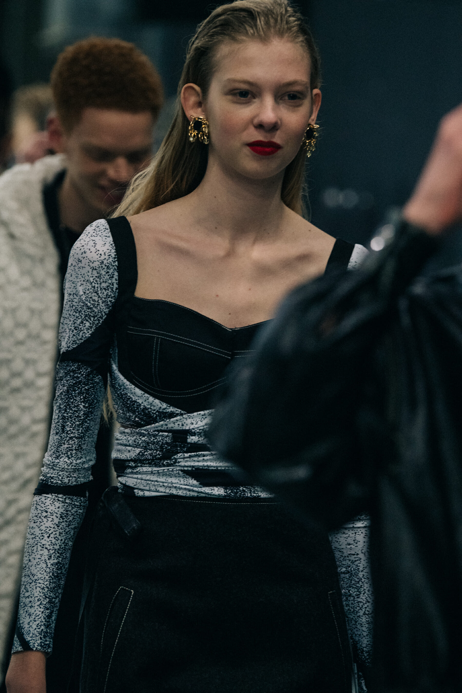 Model wearing silver and gold jewellery