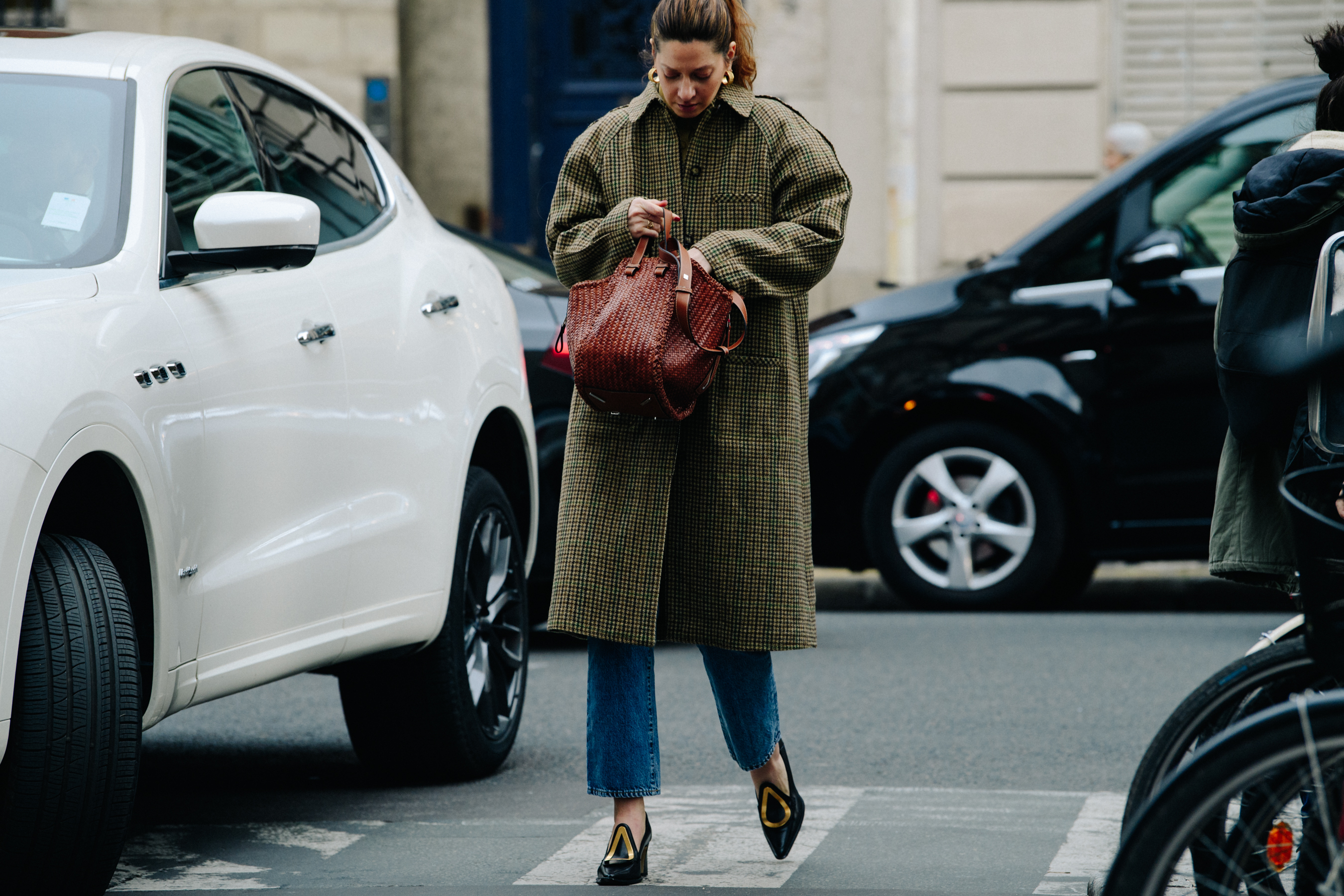 Woman carrying brown bag