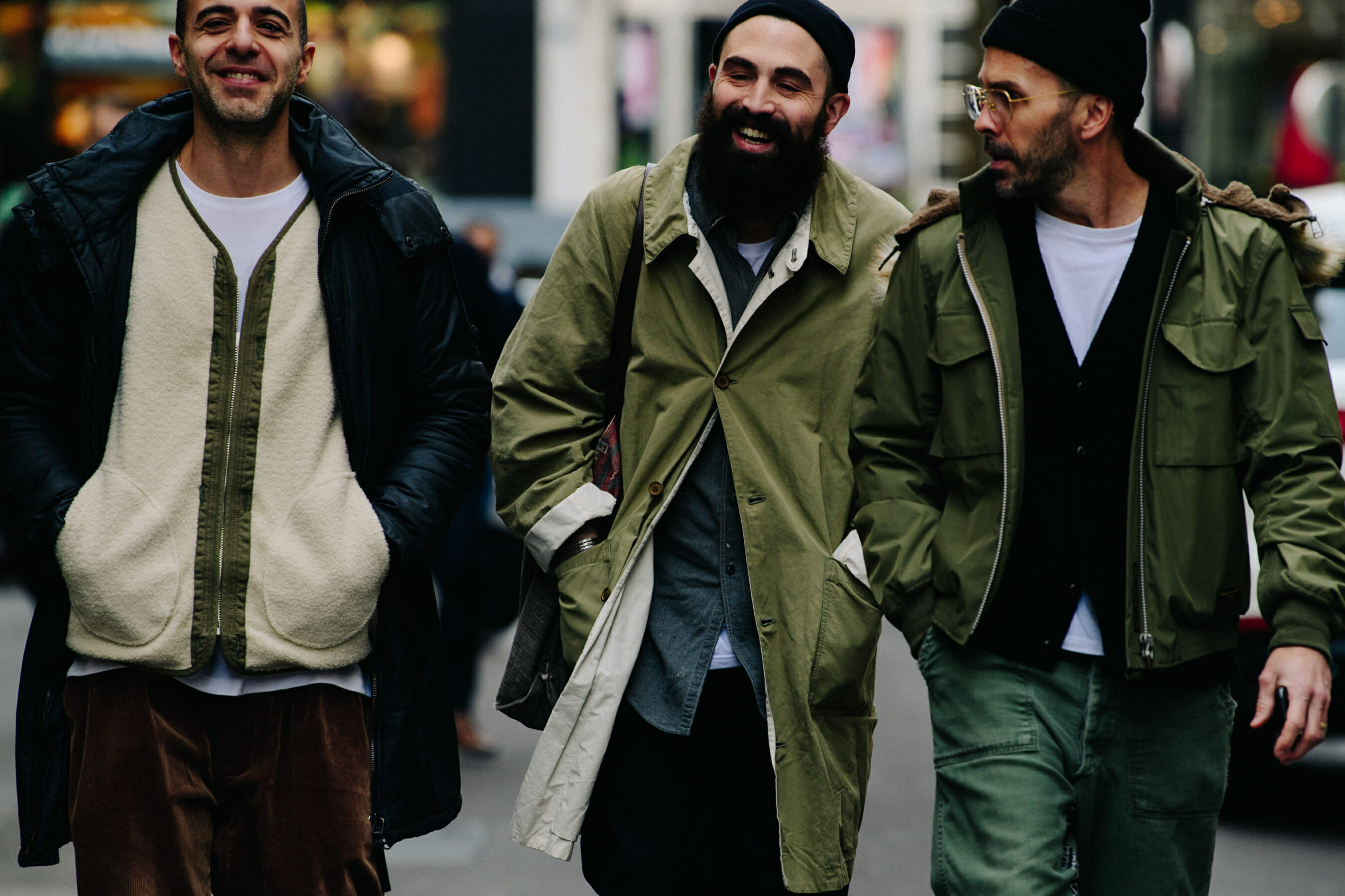 Three men wearing green