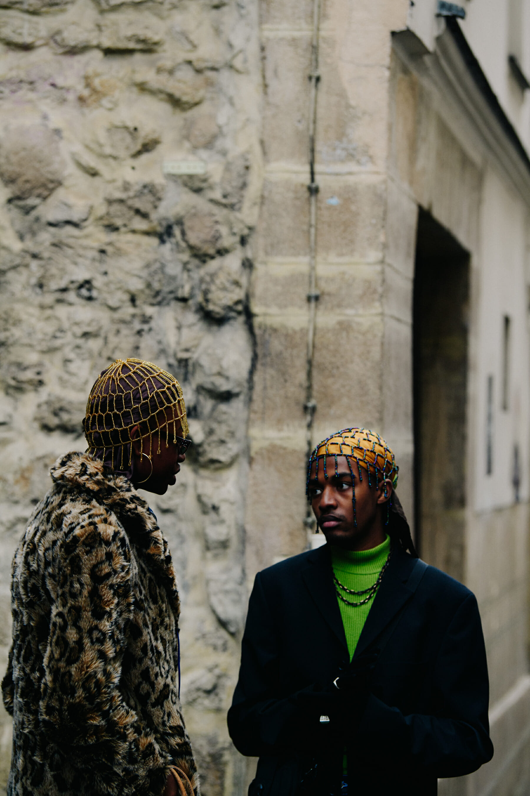 Two men wearing headdresses