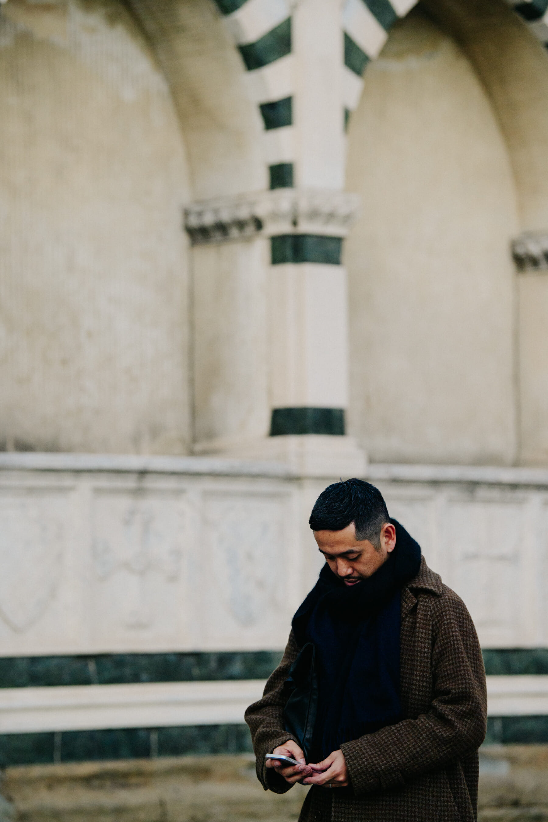 Man wearing brown coat
