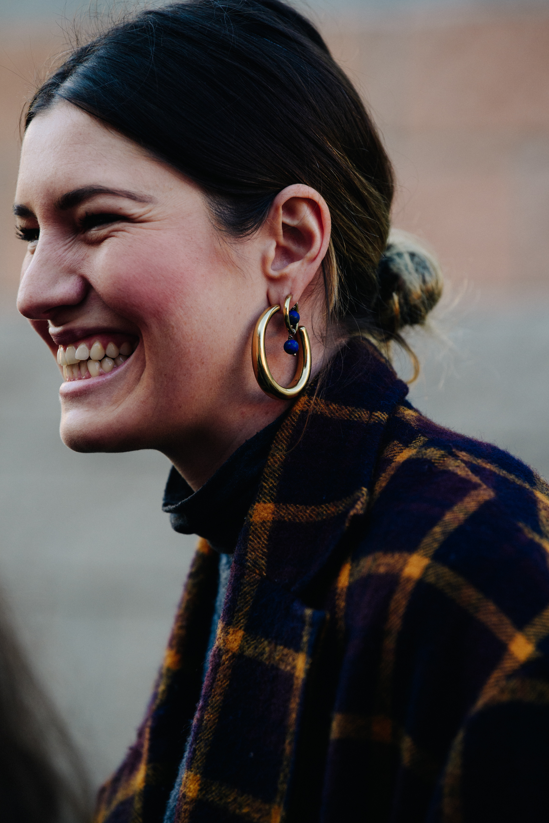 Woman wearing large hoop earrings