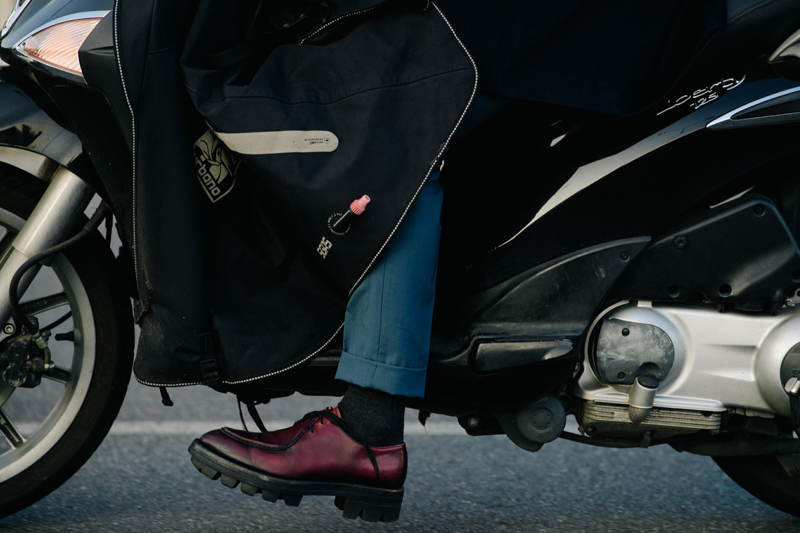 Man wearing red leather shoes