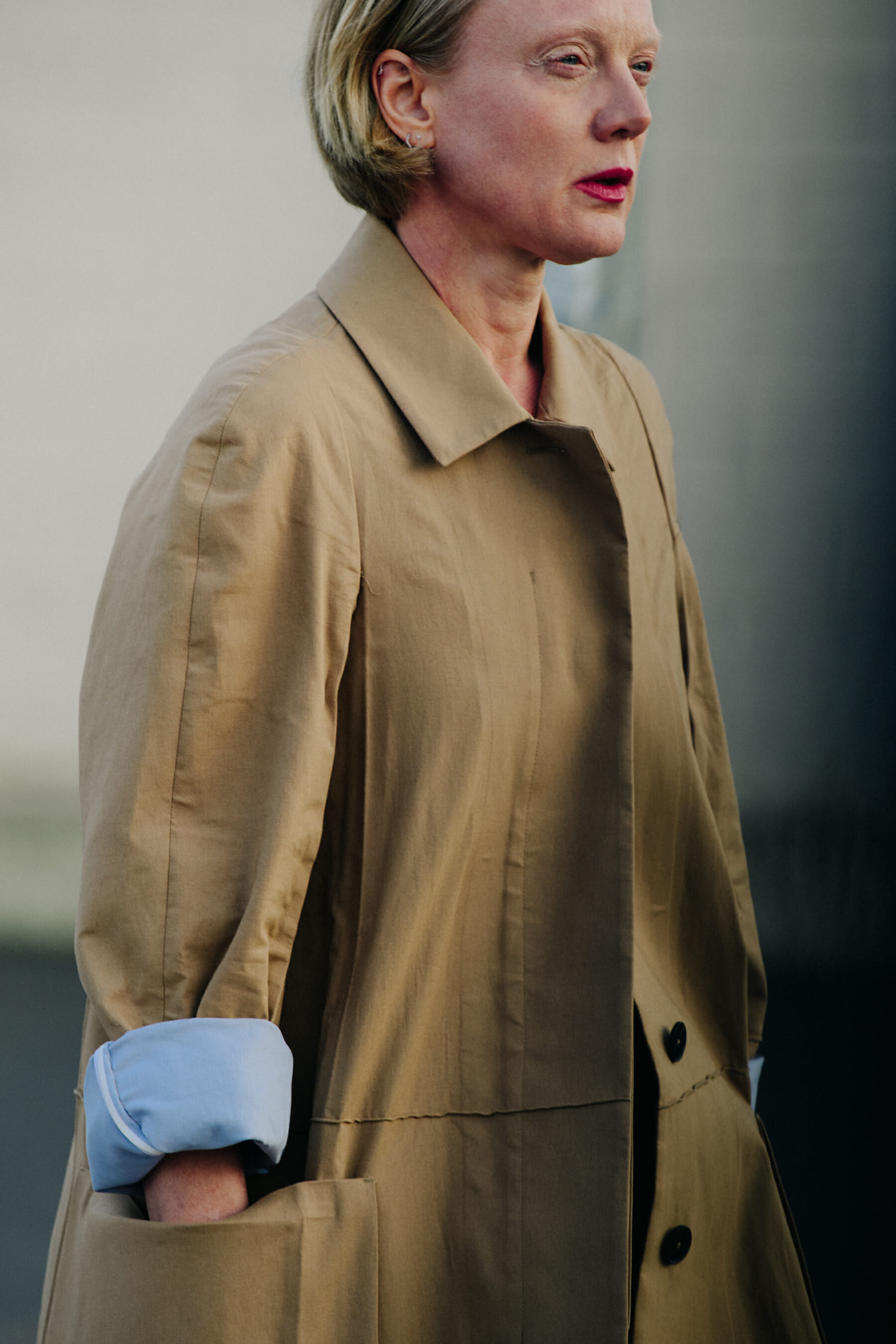 Woman wearing tan coat