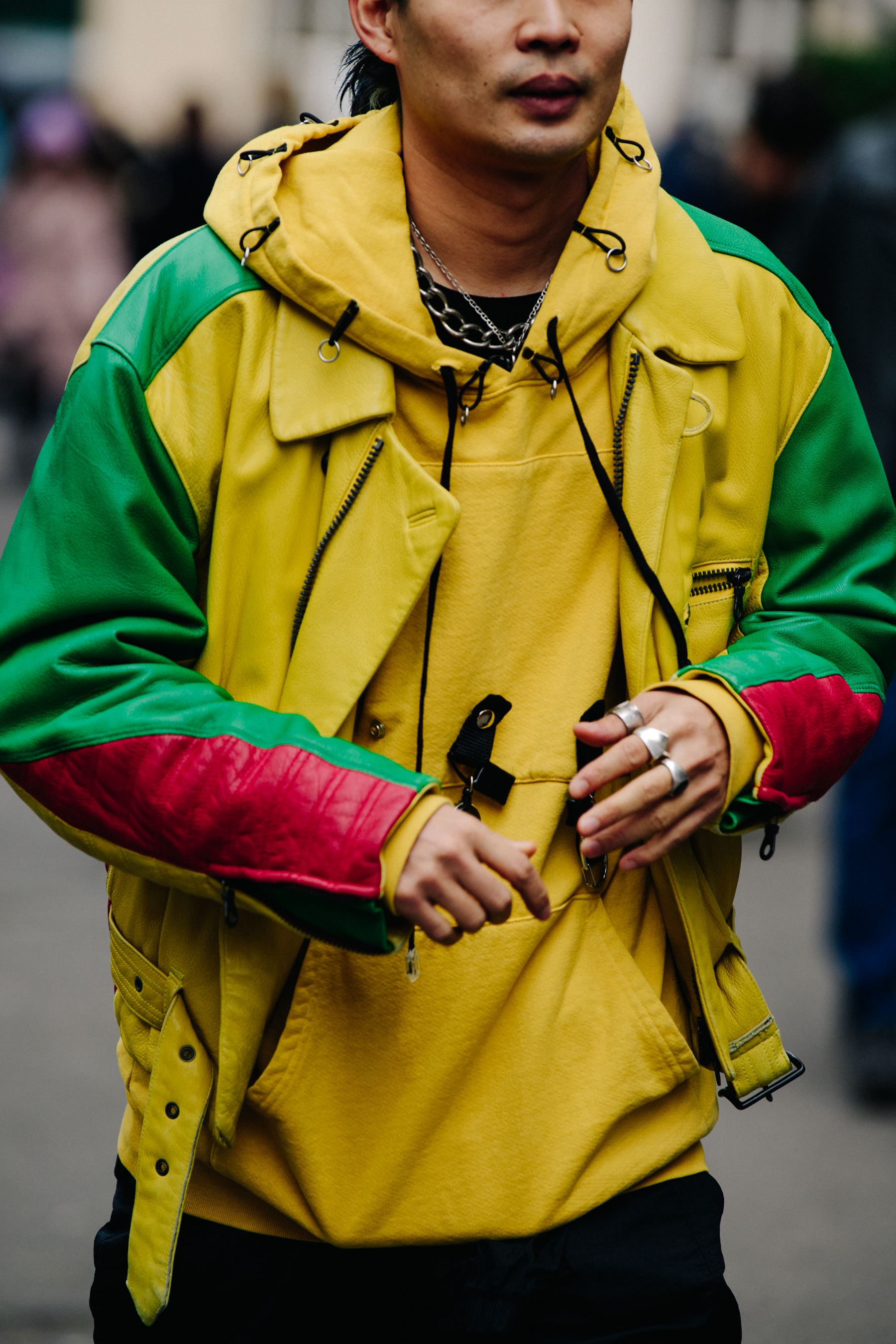 Man wearing yellow hoodie