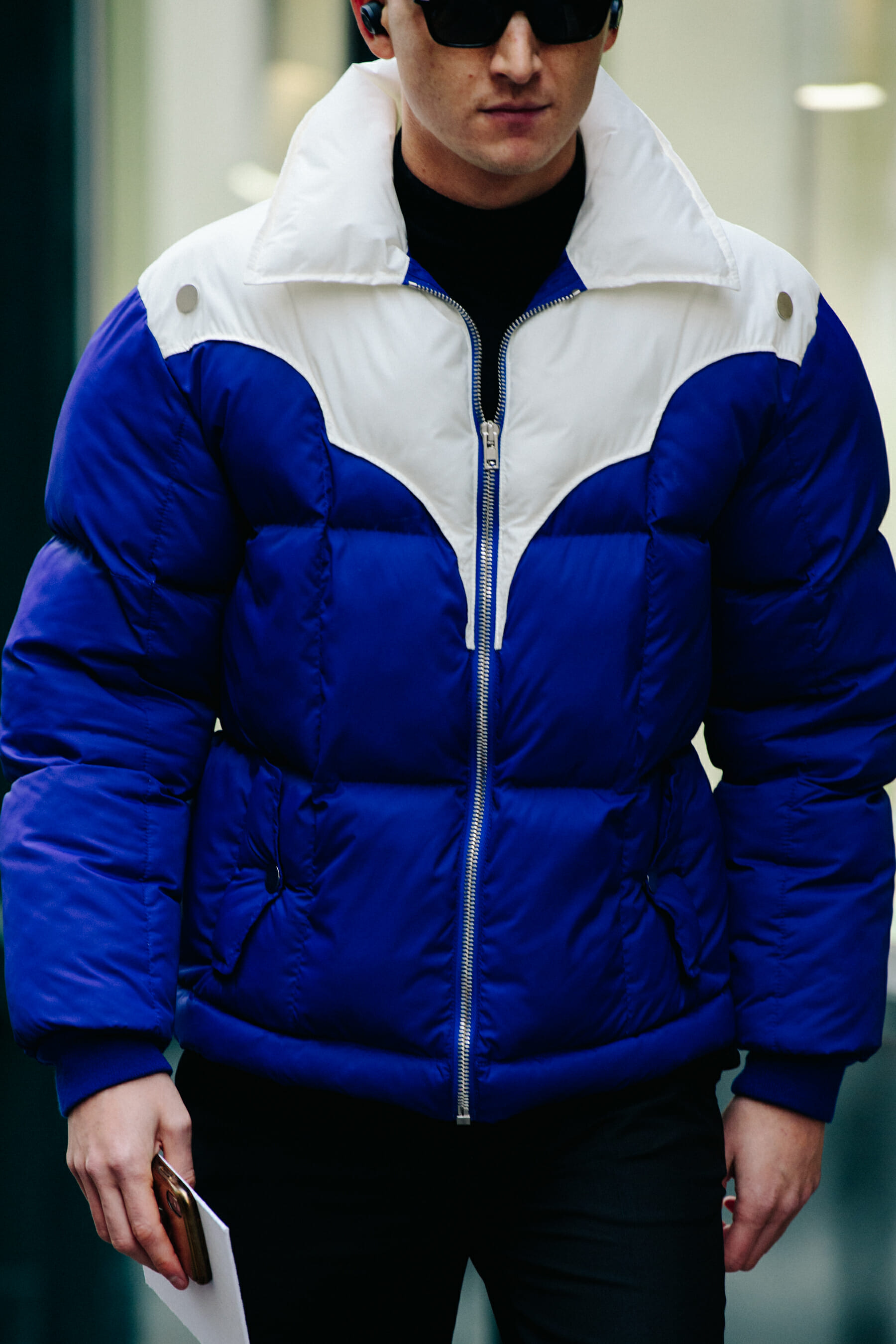 Man wearing blue and white jacket
