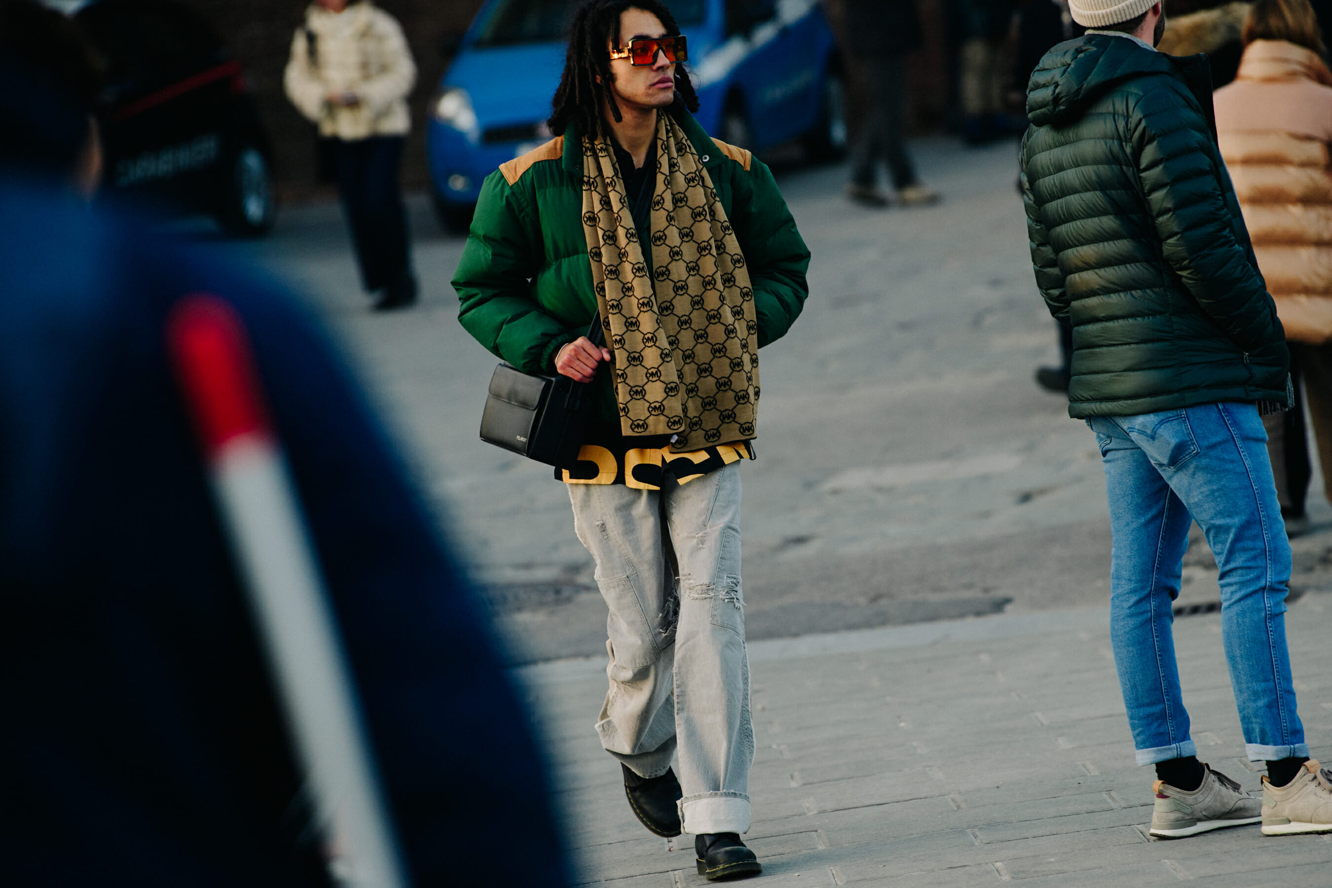 Man wearing tan scarf