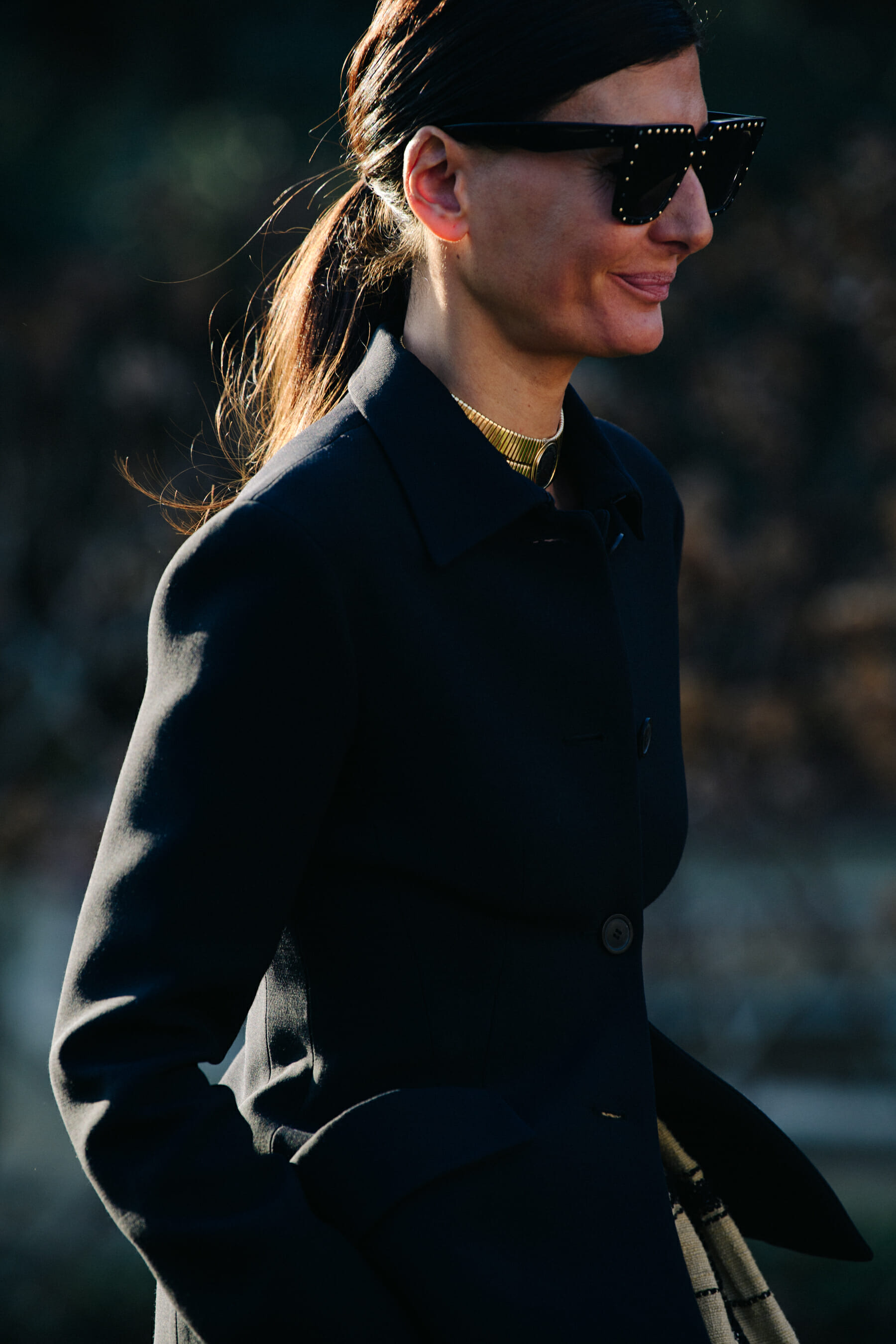 Woman wearing gold necklace