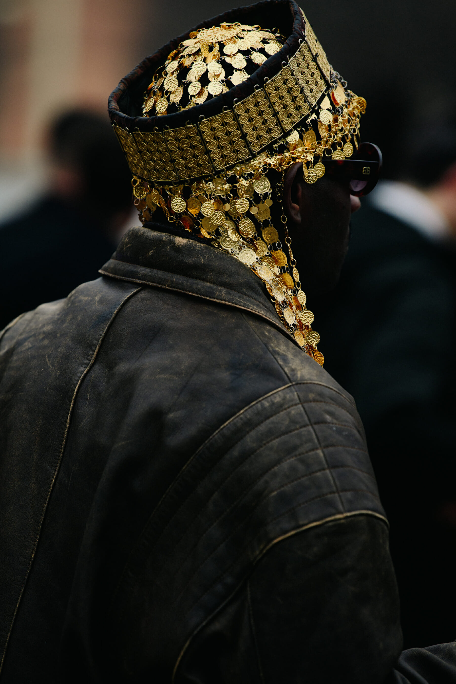 Man wearing gold hat