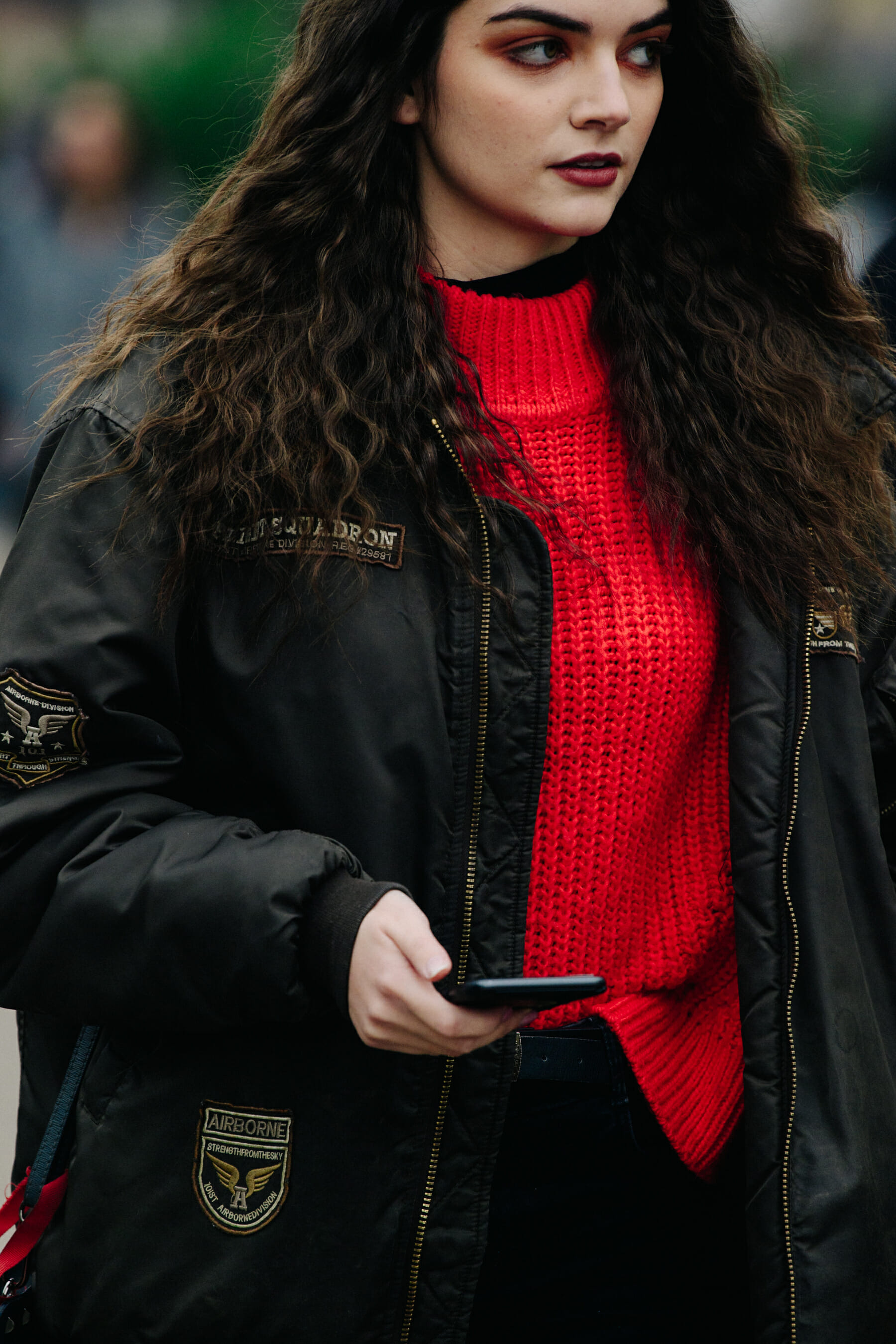 Woman wearing red jumper