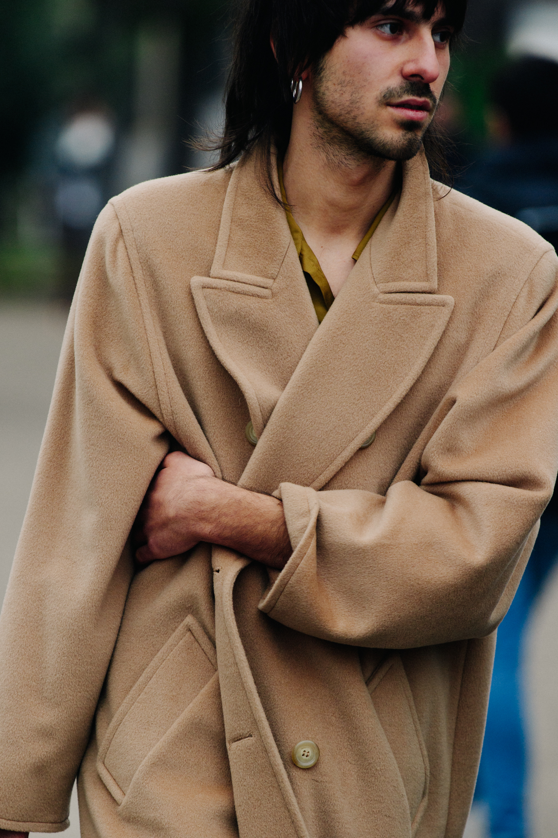 Man wearing tan coat