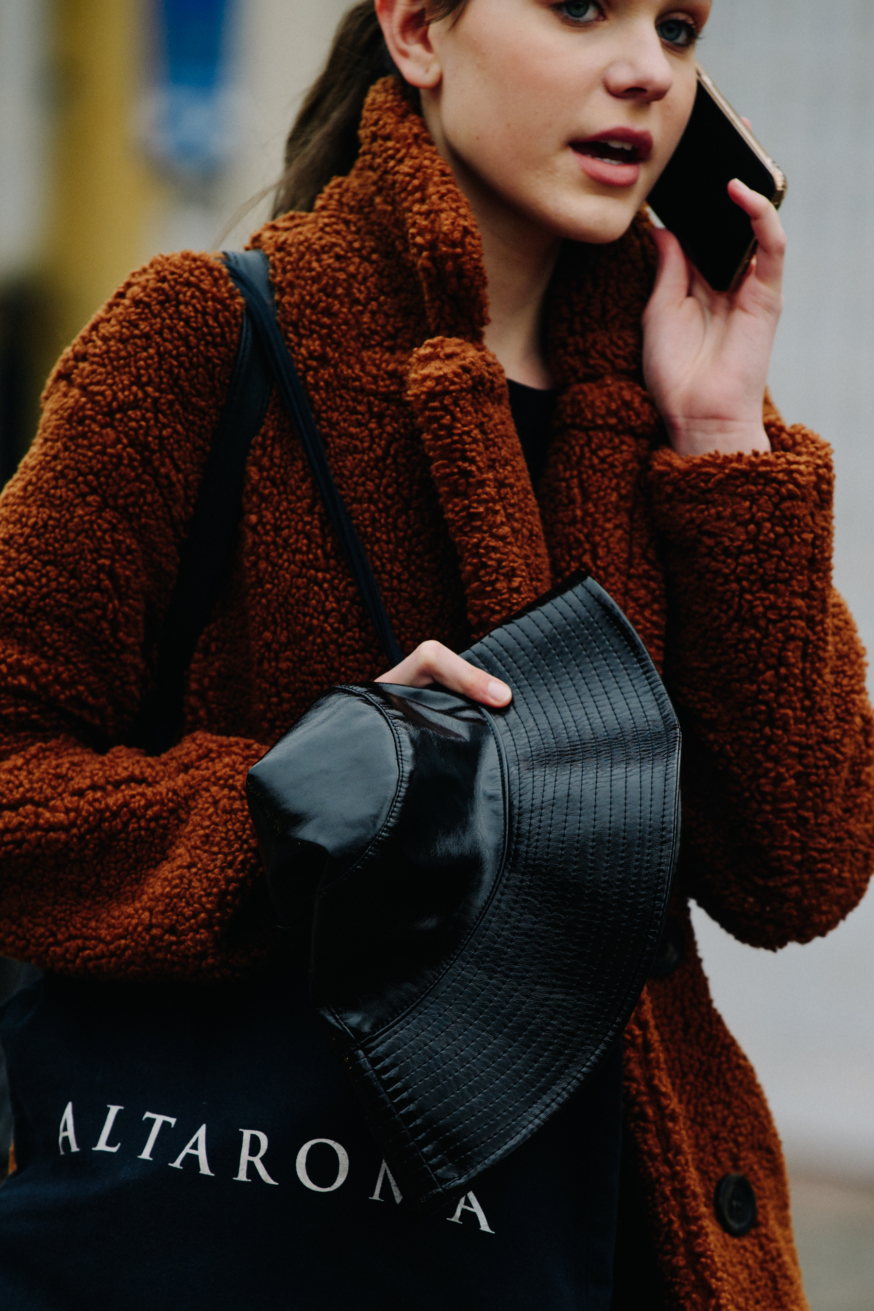Model wearing brown coat