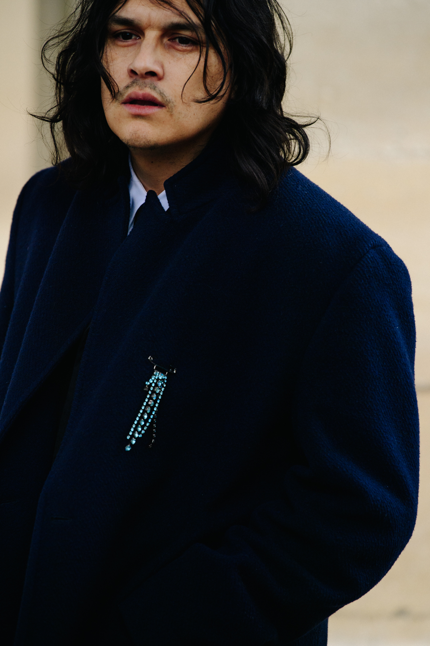 Designer wearing black coat
