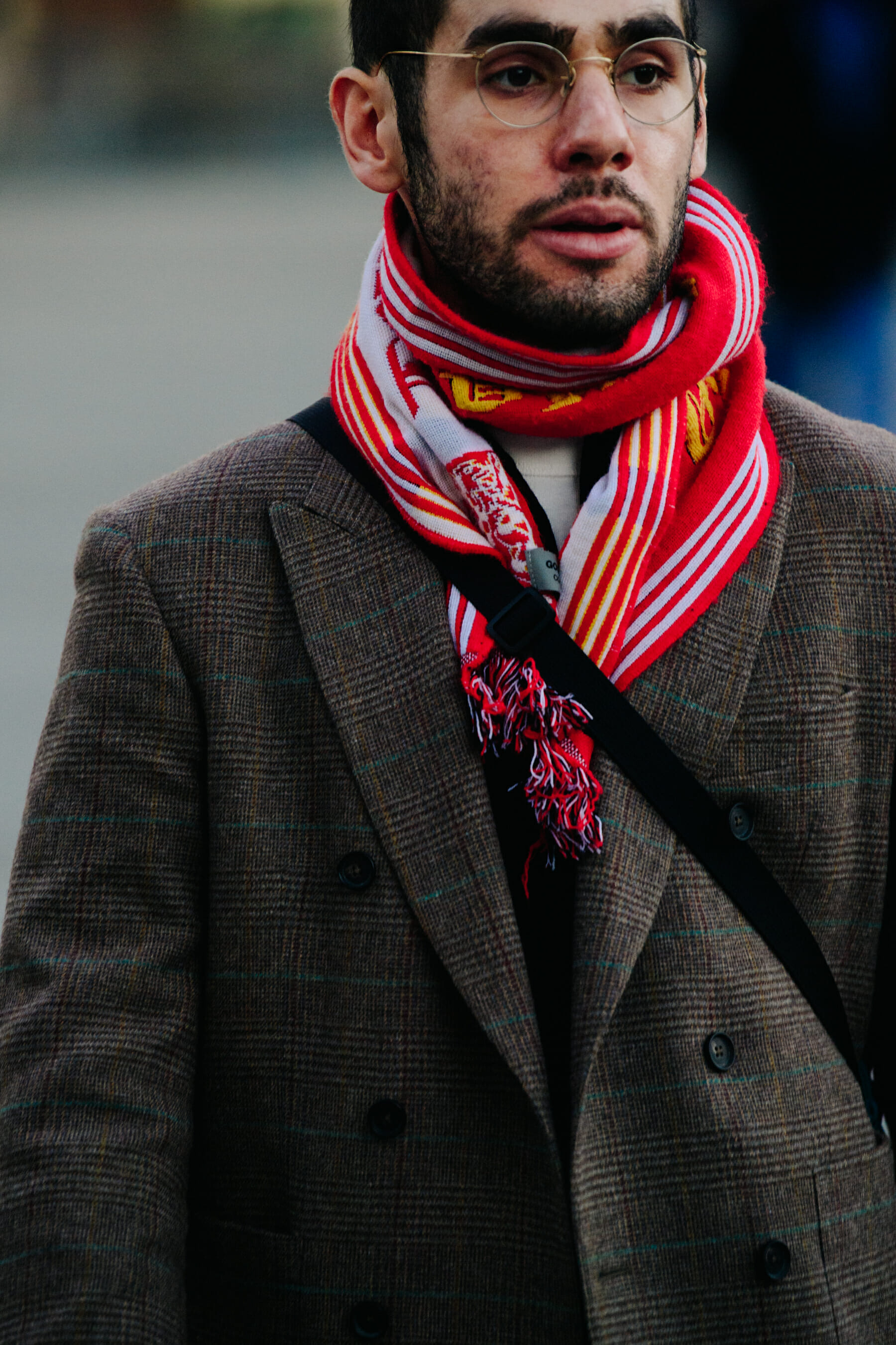 Man wearing red football scarf