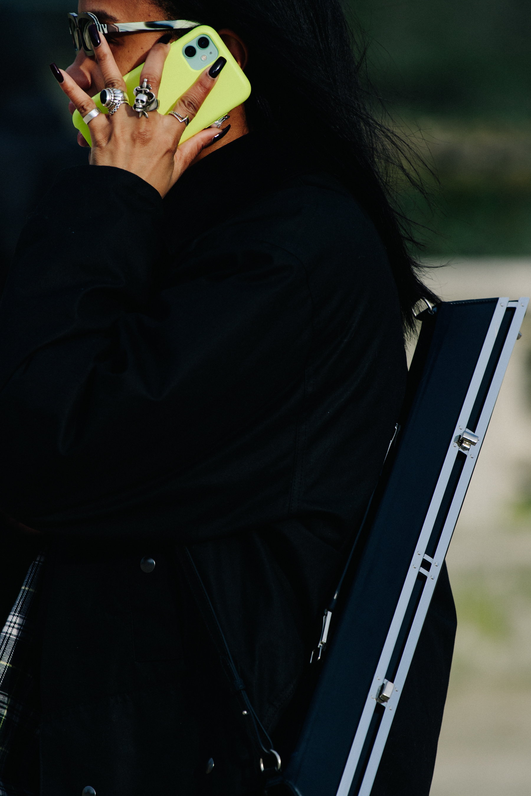 Woman carrying yellow iPhone