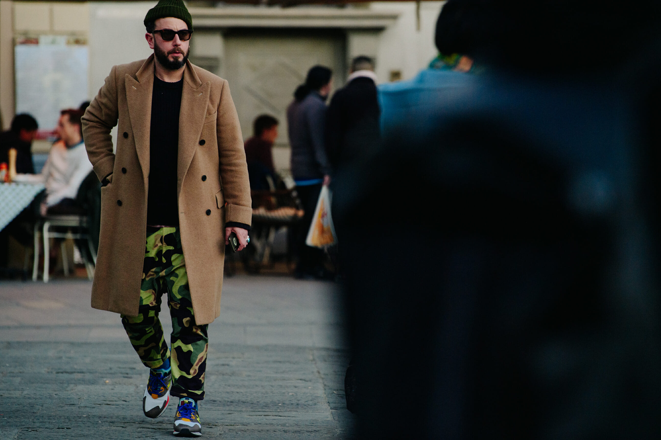 Man wearing tan coat