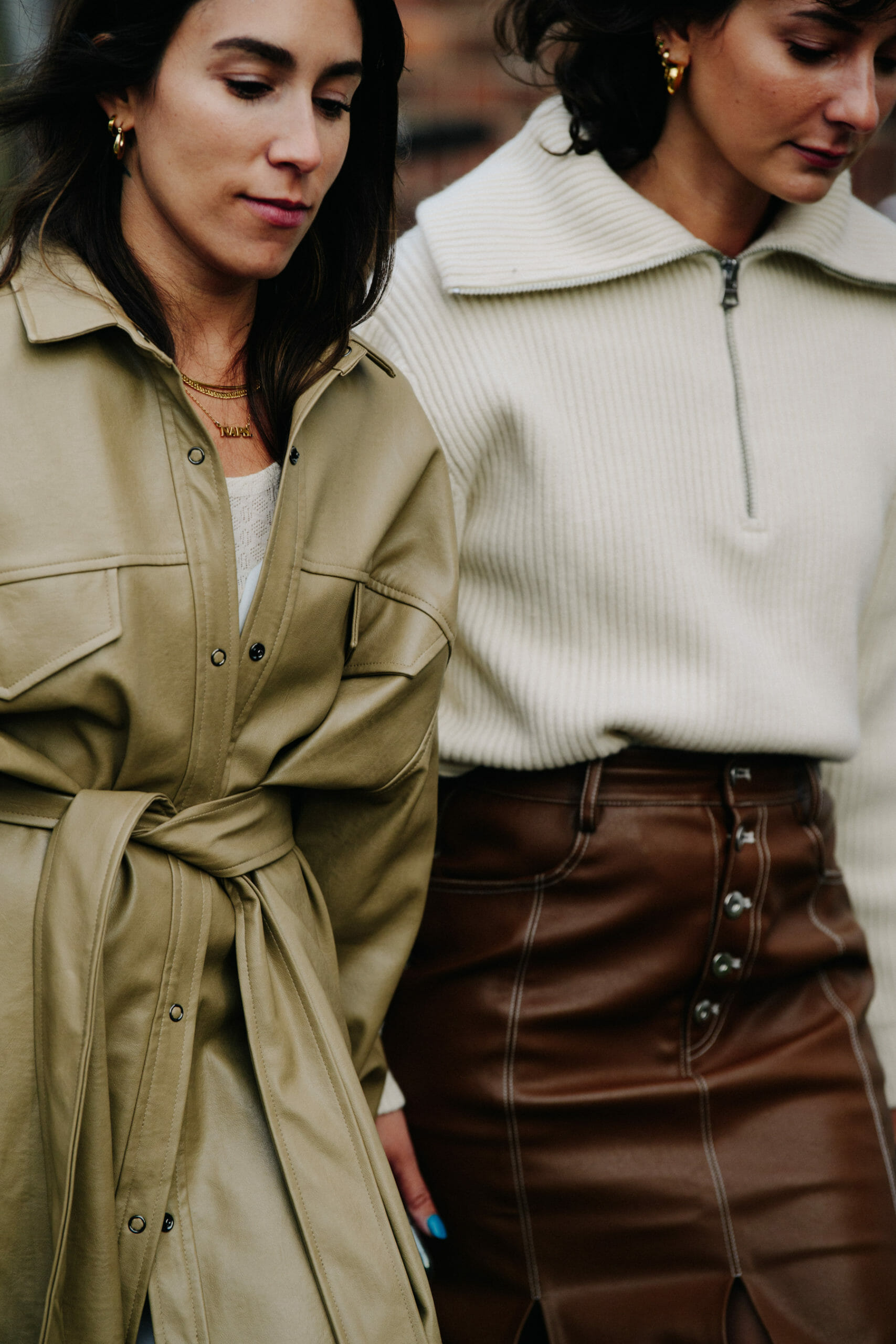 Two women wearing tan