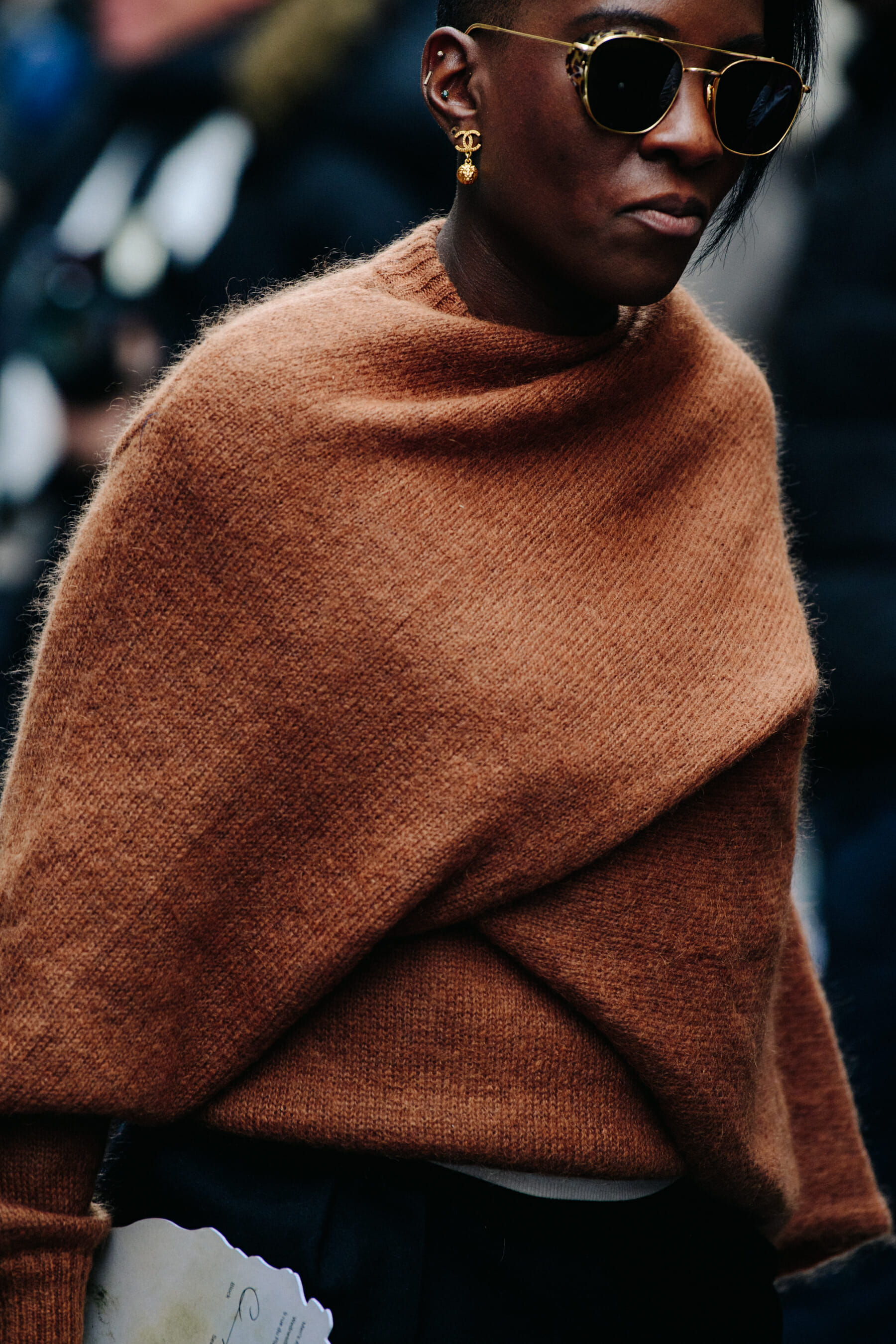 Woman wearing brown shirt
