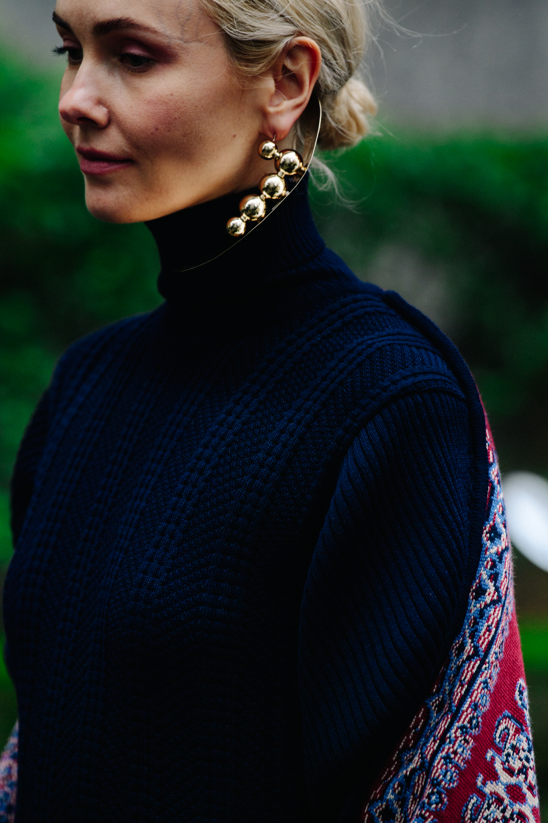 Woman wearing large gold earring