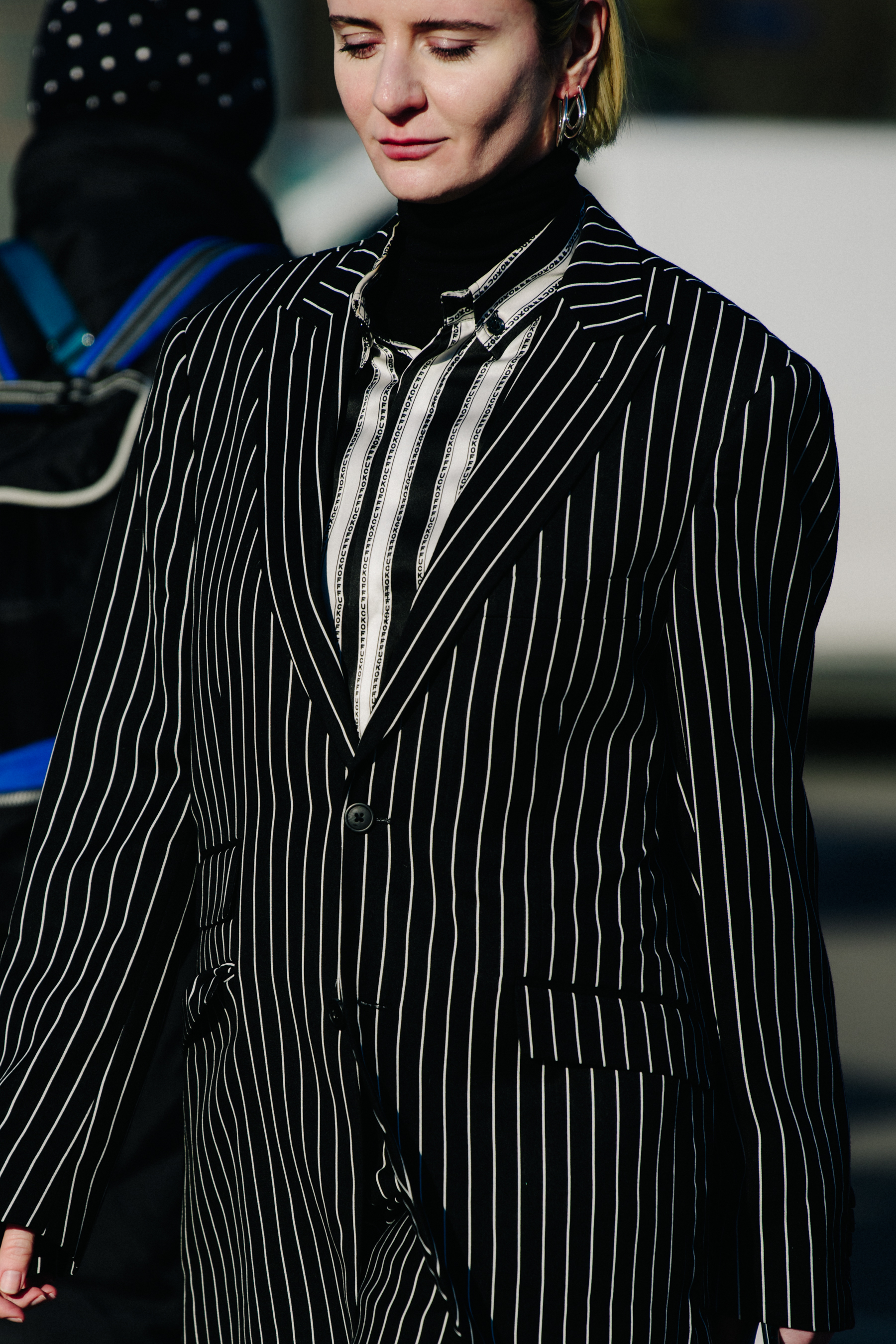 Woman wearing striped jacket