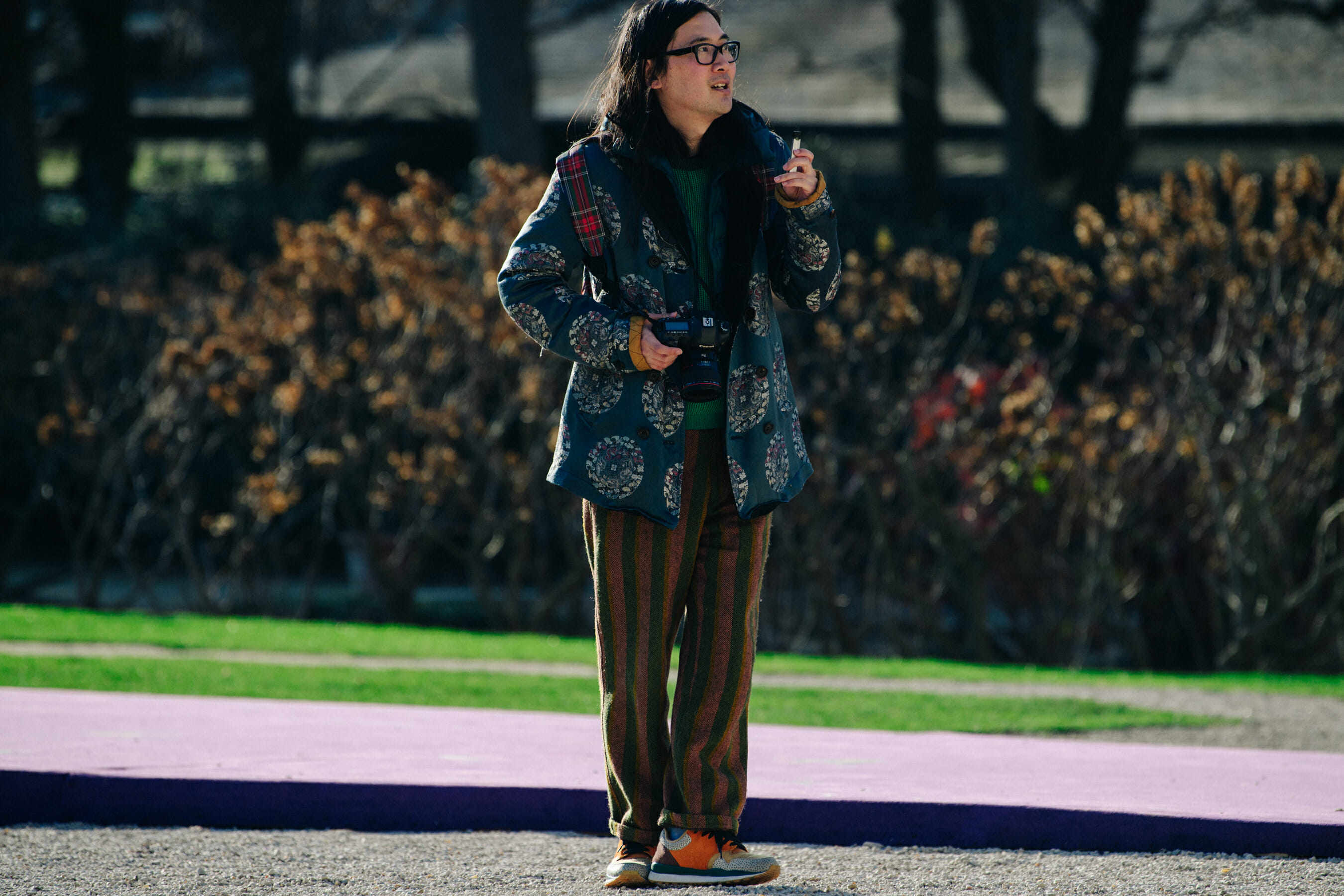 Photographer wearing striped pants