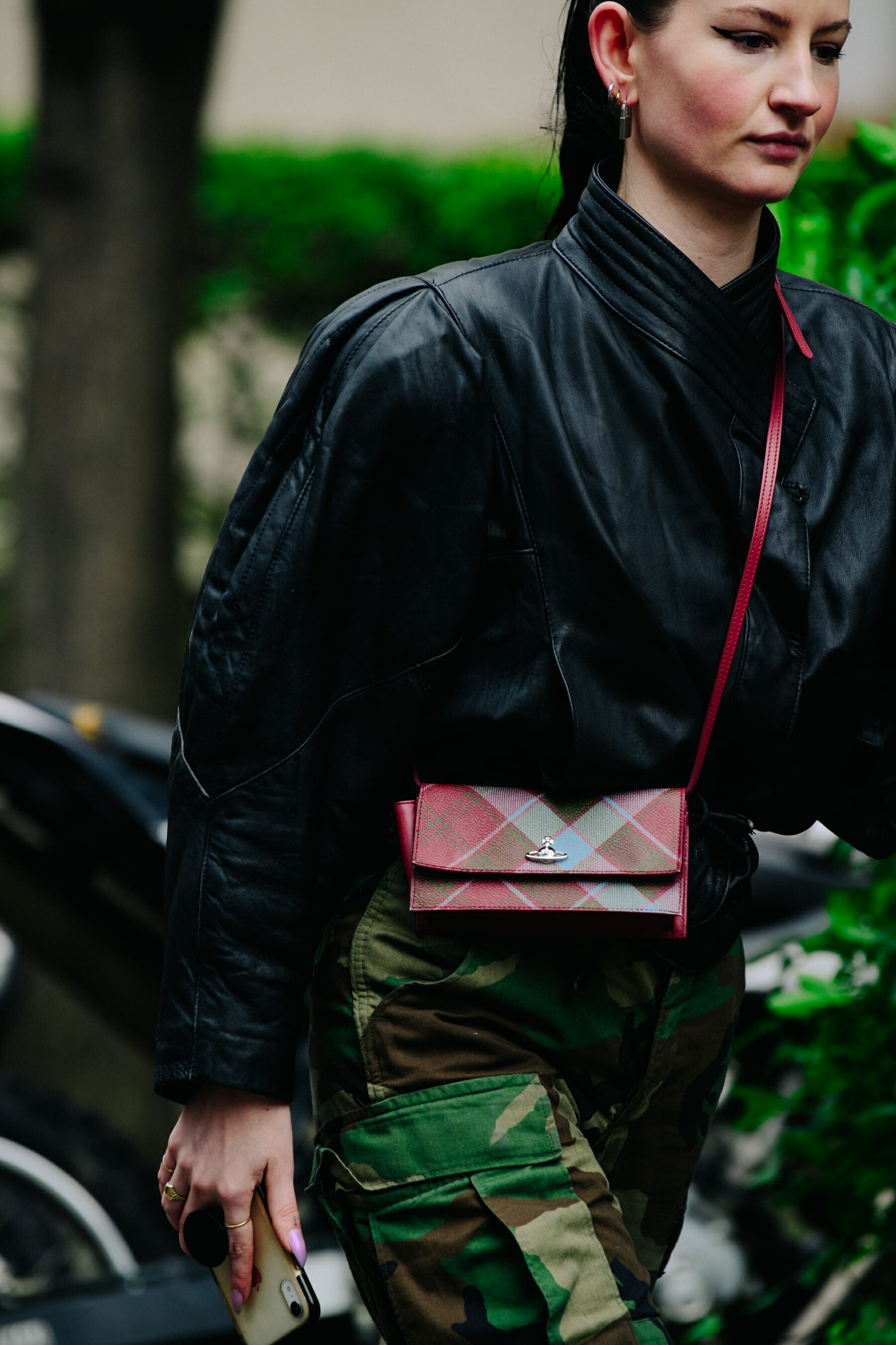Woman carrying Vivienne Westwood bag